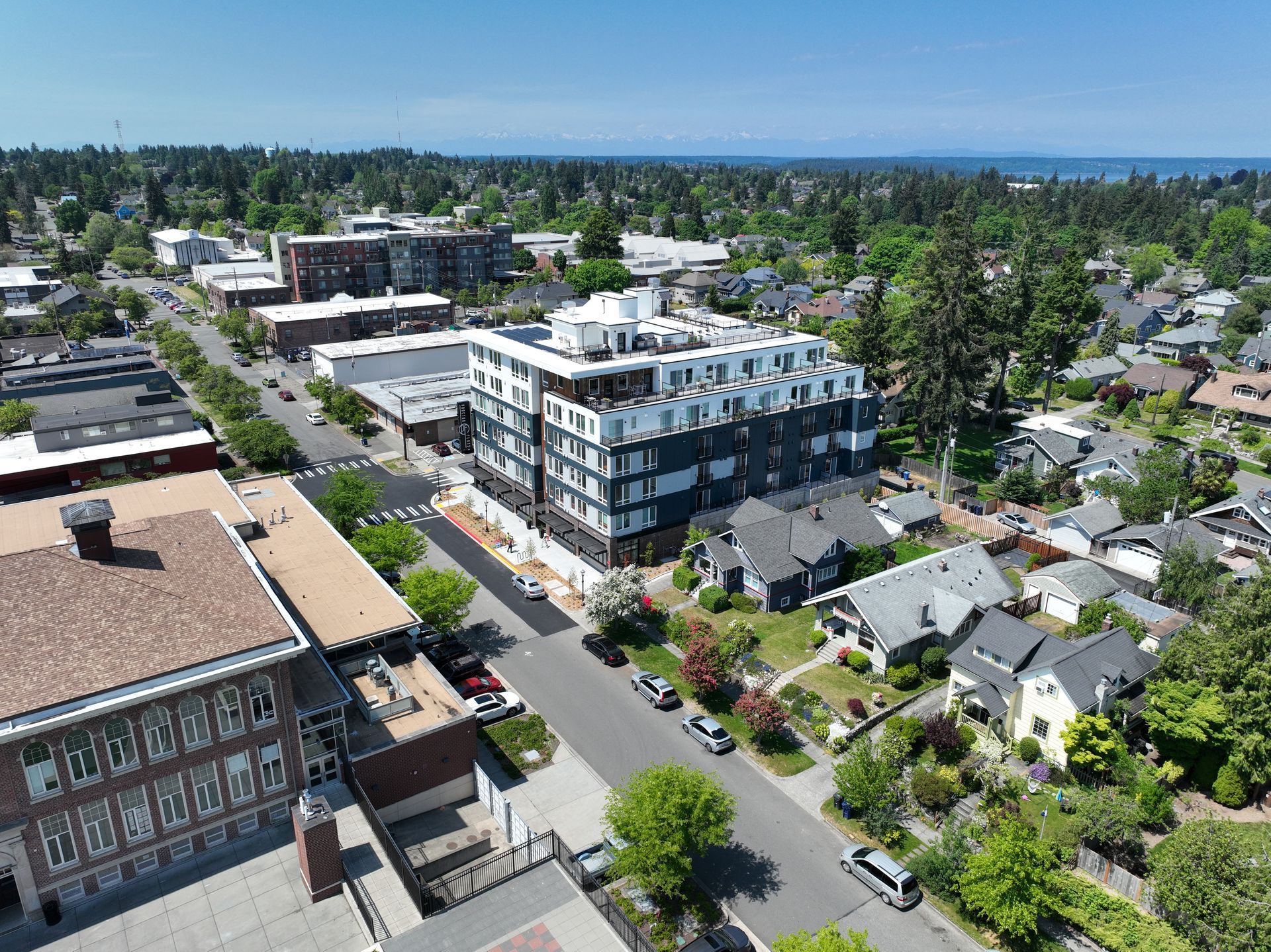 An aerial view of a city with lots of buildings and trees