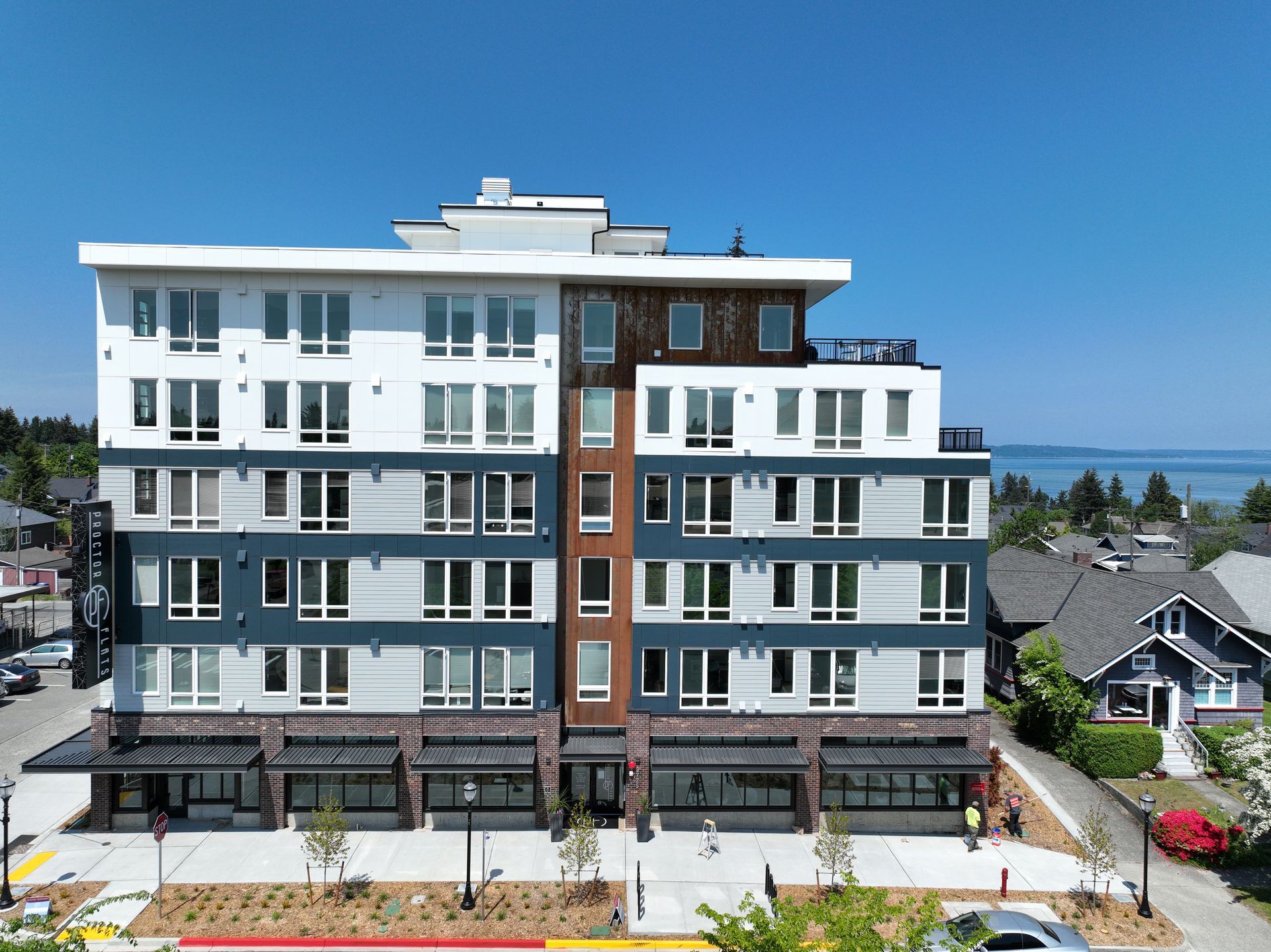 An aerial view of a large apartment building with lots of windows