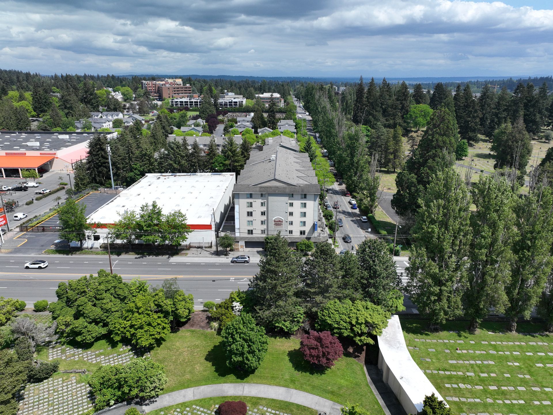 An aerial view of a city with lots of trees and buildings