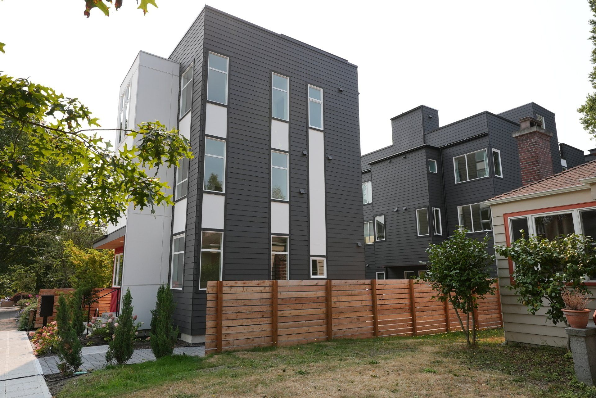 A large building with a wooden fence in front of it