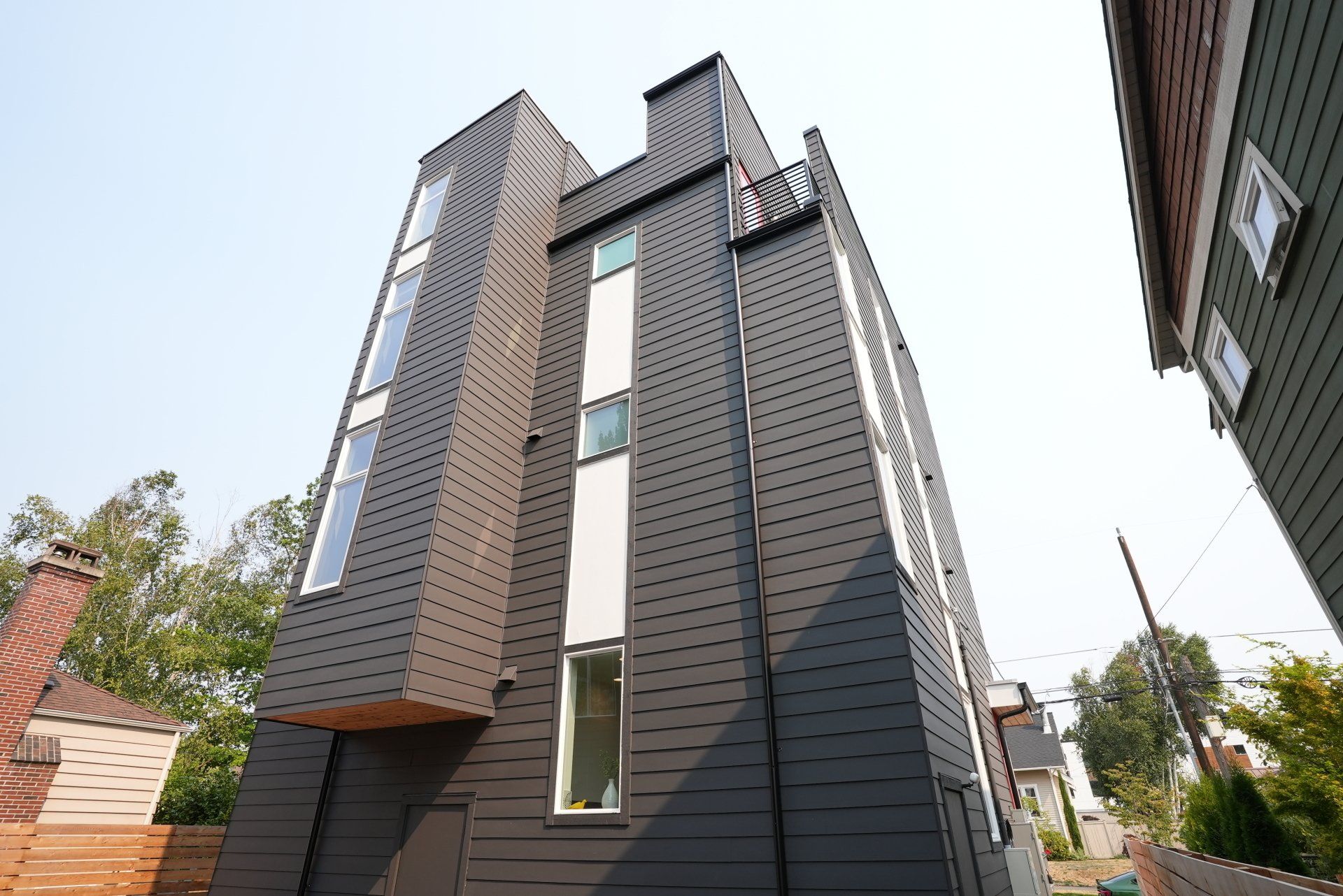 A tall building with a balcony on the top of it