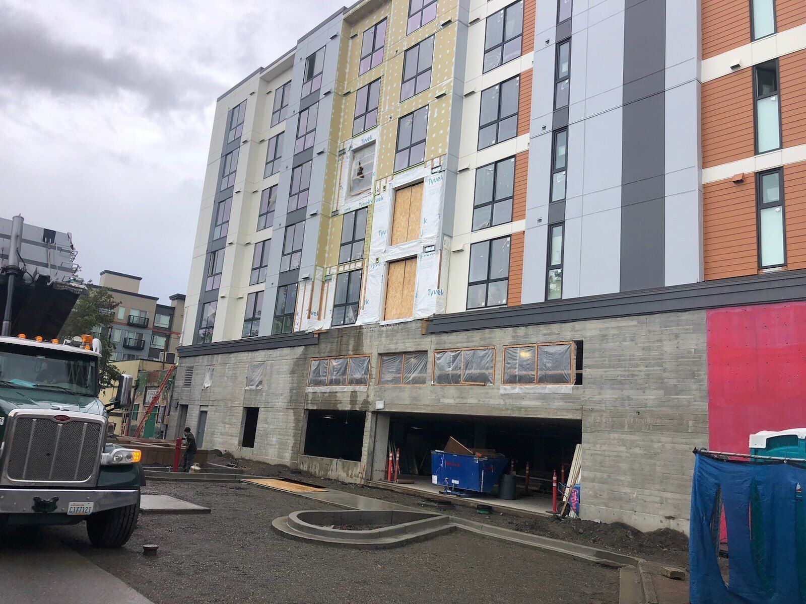 Finished fiber cement panel siding and windows at Di