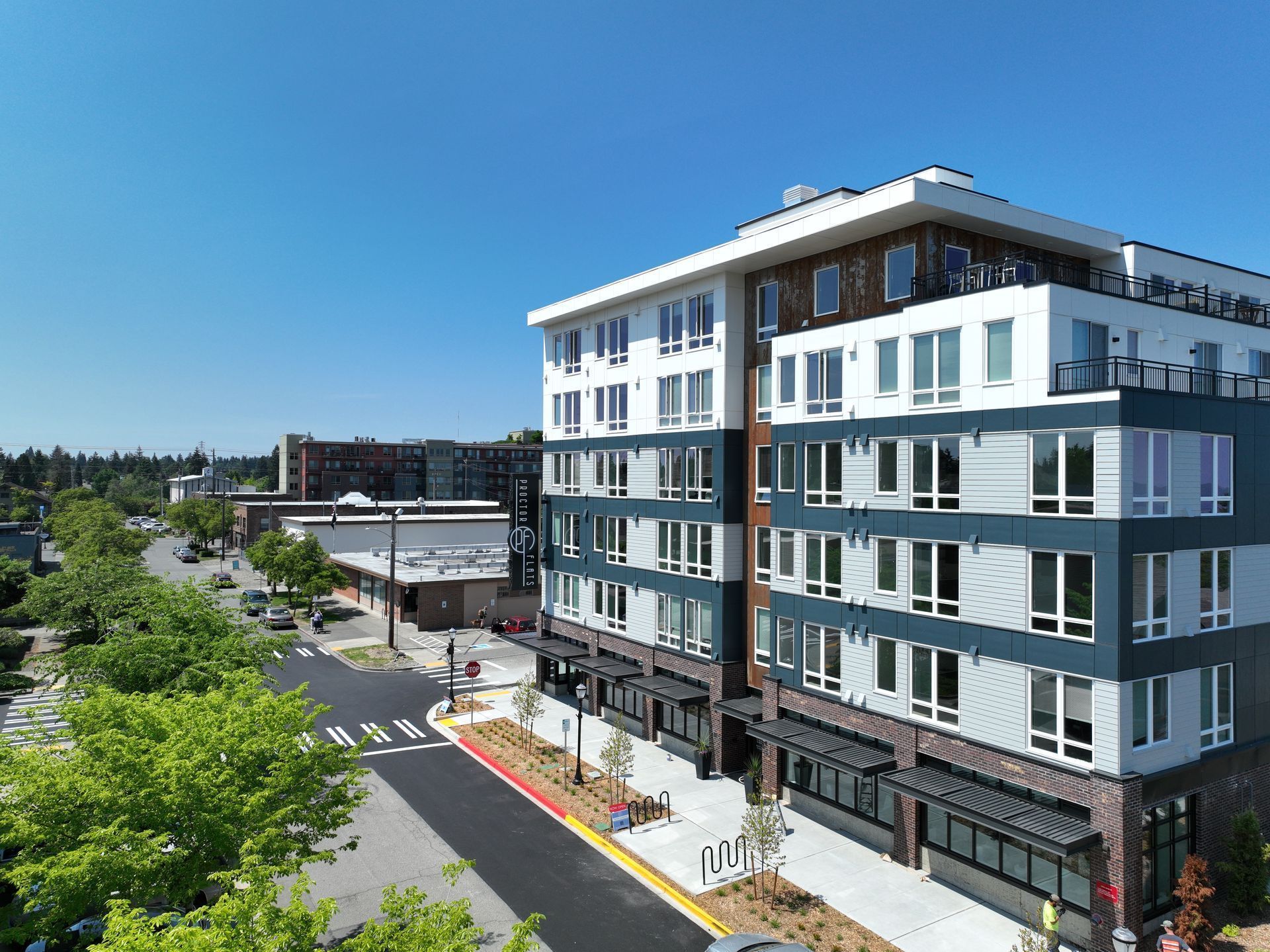 An aerial view of a large apartment building in a city.