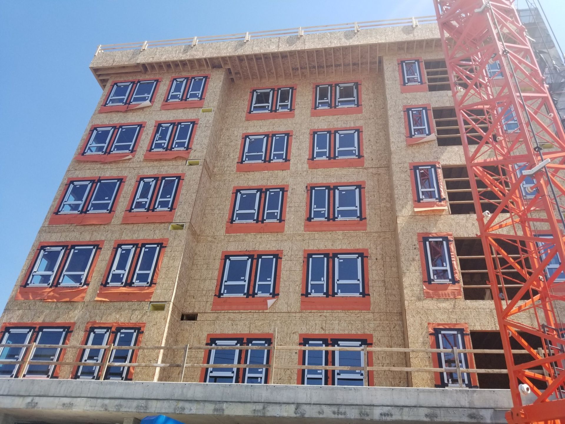 Two10 apartments in Shoreline with sheathing and flashed windows before siding
