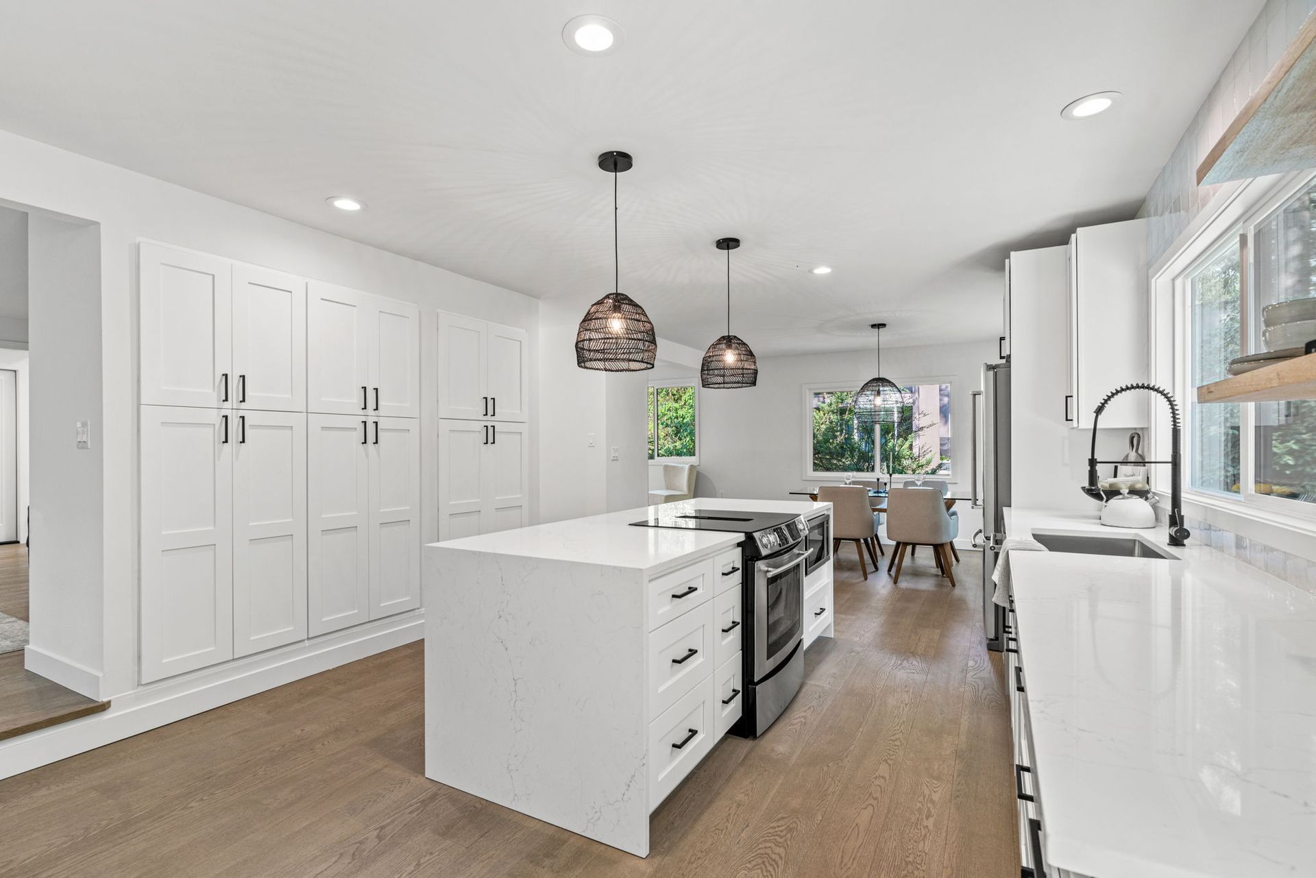 There is a large island in the middle of the kitchen.