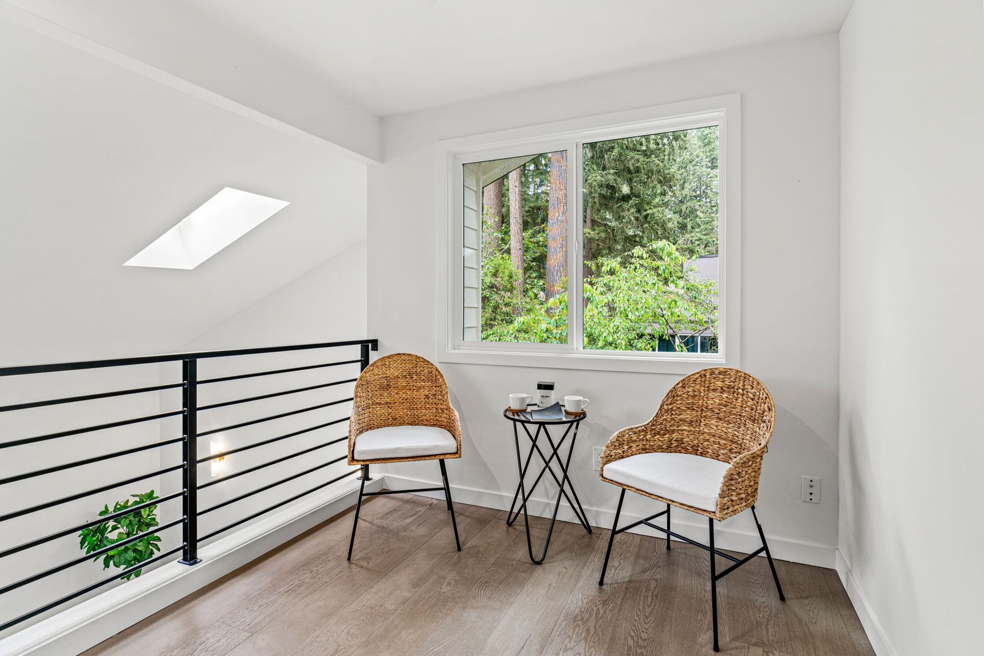There are two chairs and a table in the room.
