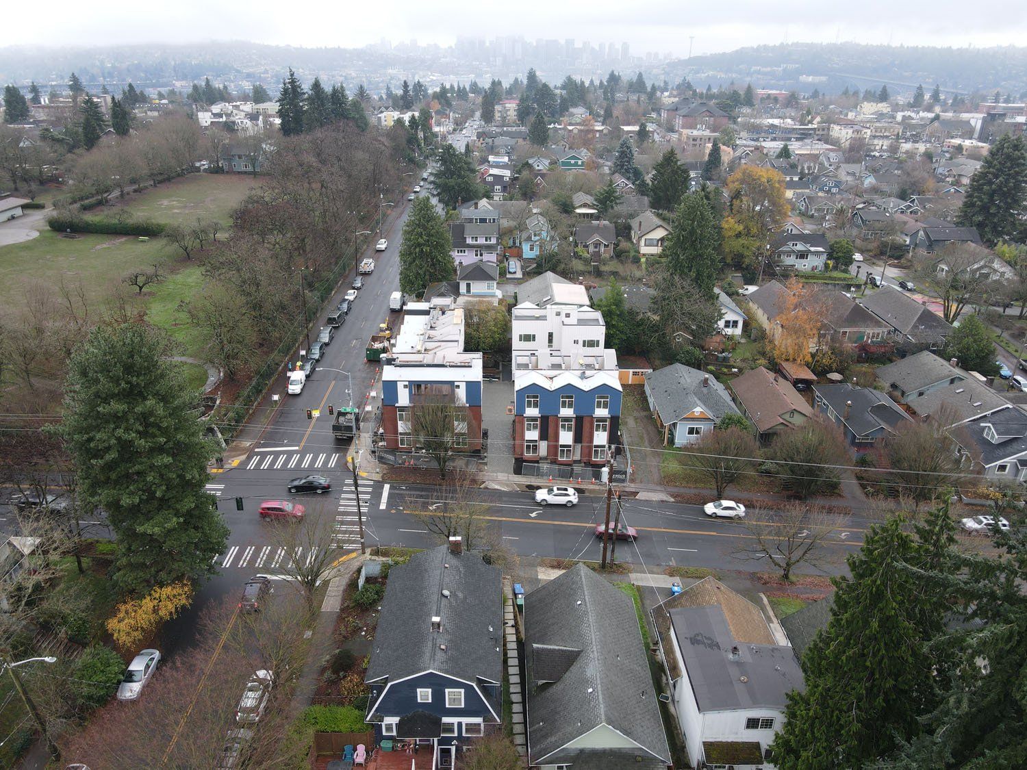 An aerial view of a residential area with a lot of houses and trees.