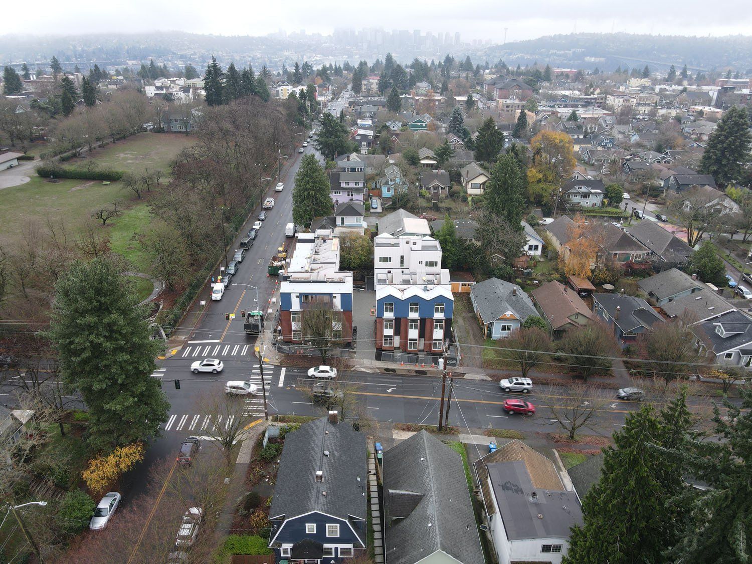 An aerial view of a residential area with a lot of houses and trees.