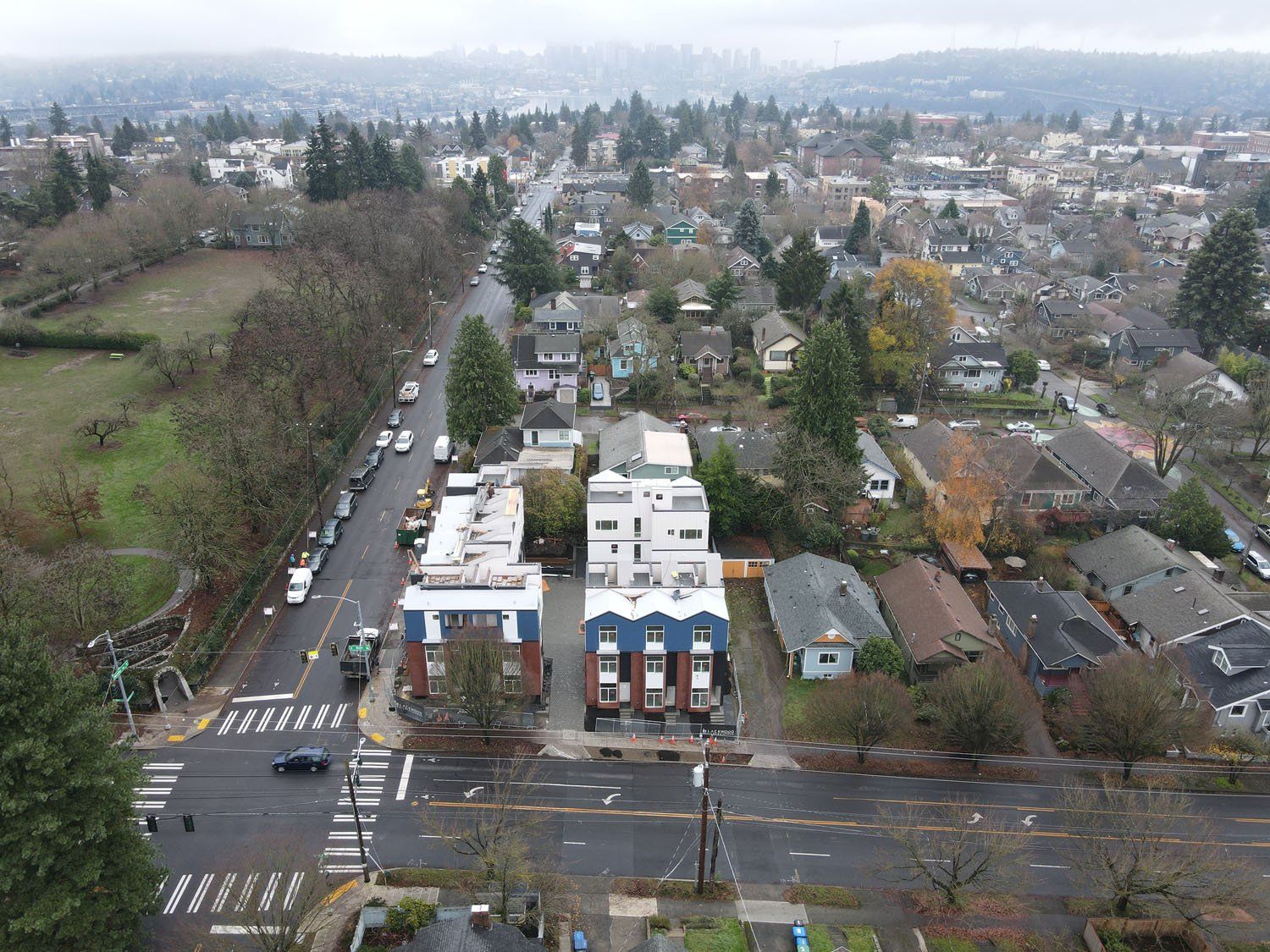 An aerial view of a city with a lot of buildings and trees.