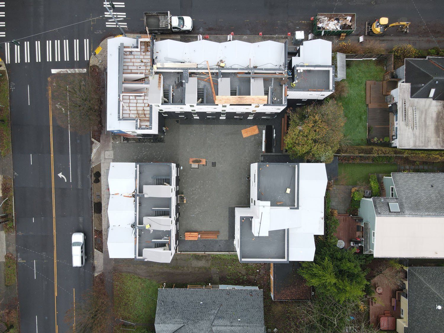 An aerial view of a building under construction in a city