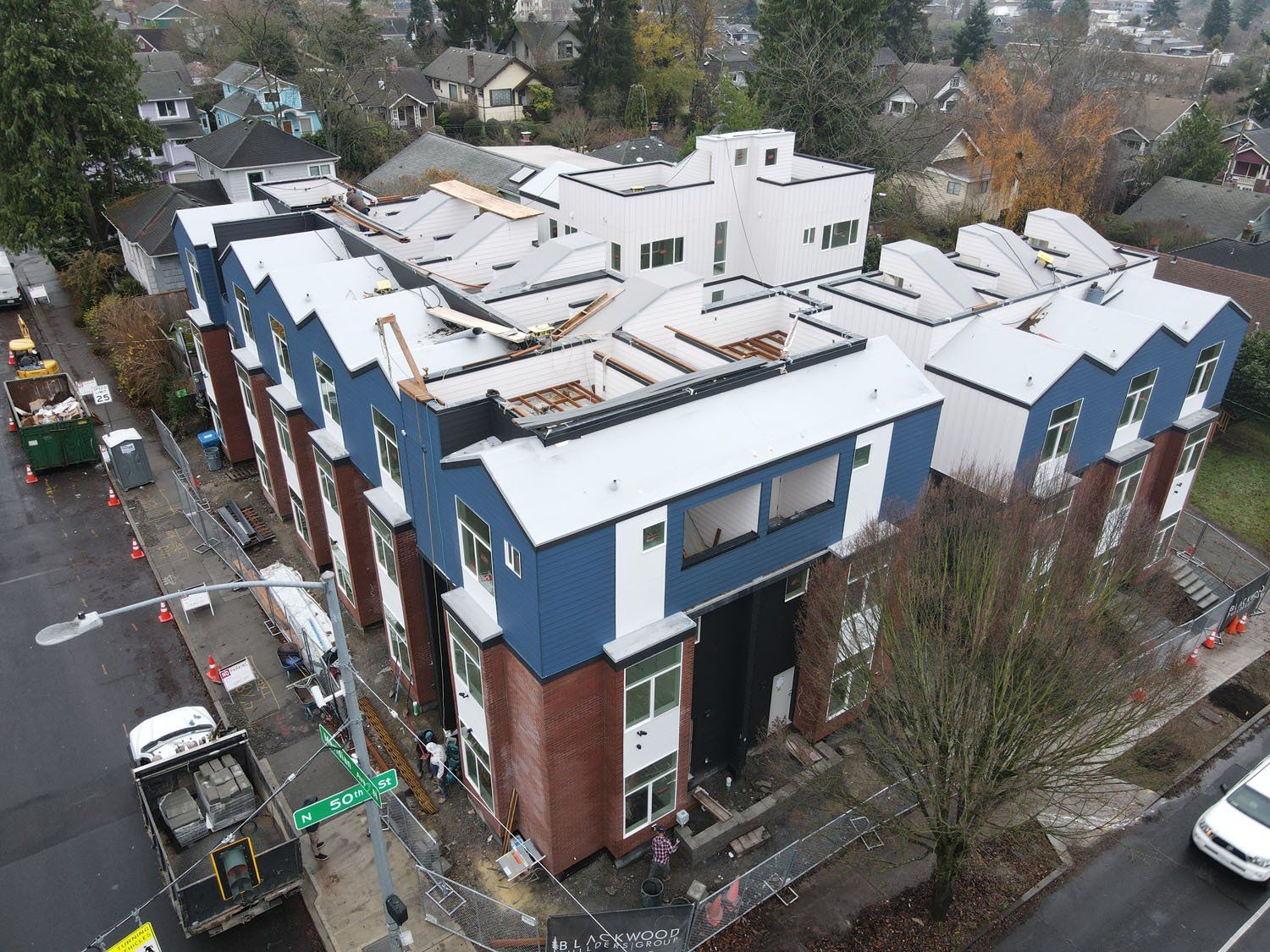 An aerial view of a building under construction in a city