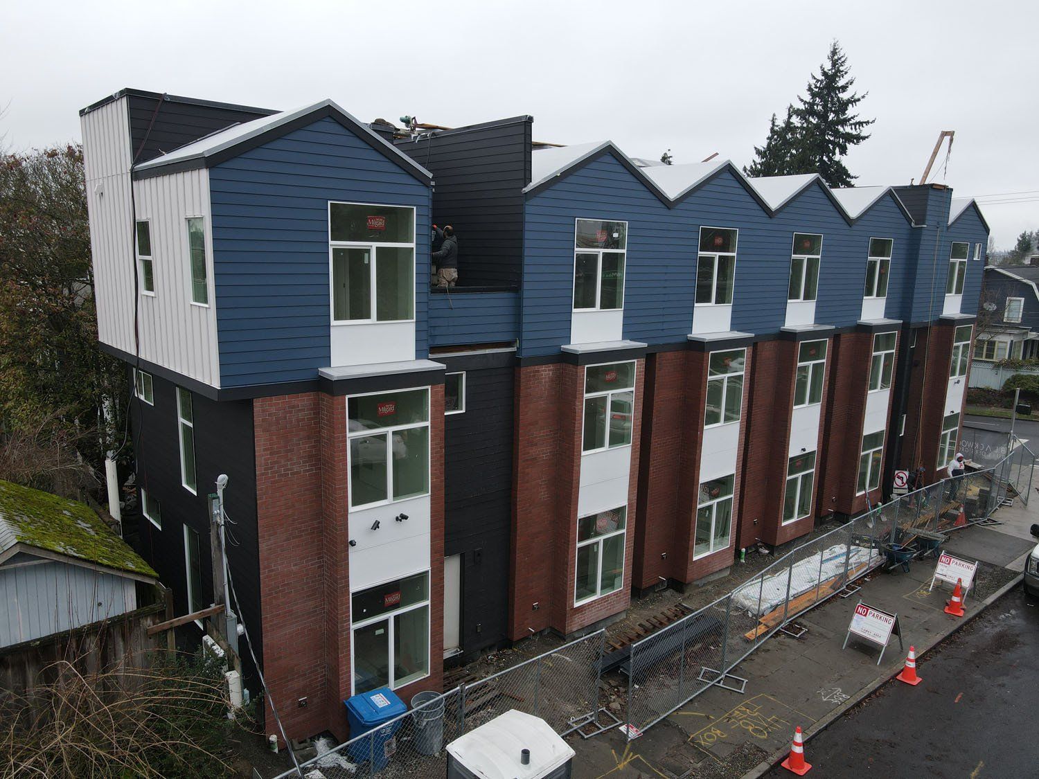 An aerial view of a row of apartment buildings under construction.