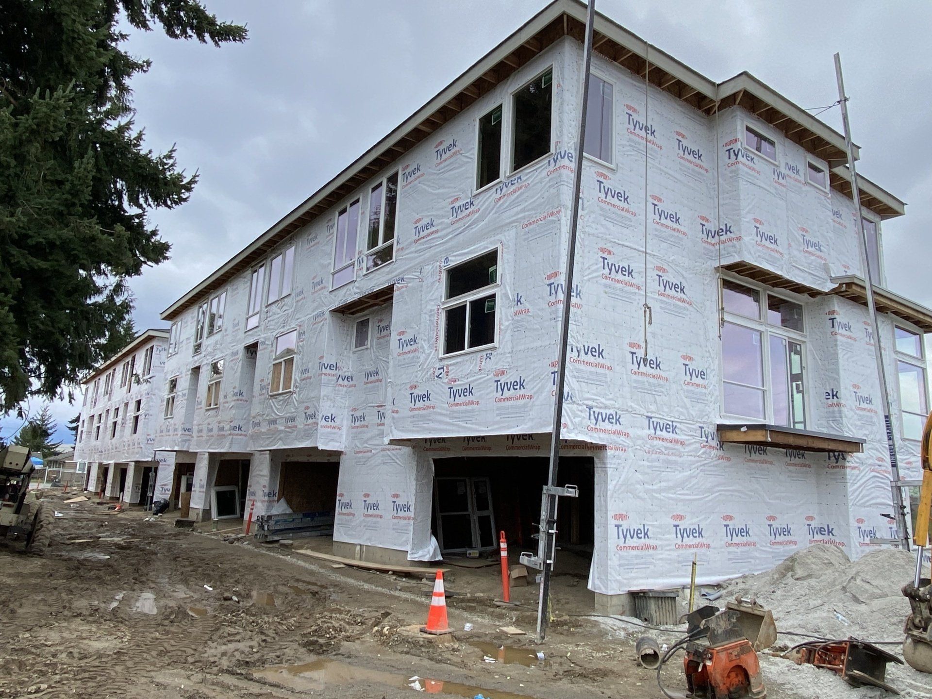 A large building is being built with a lot of windows.