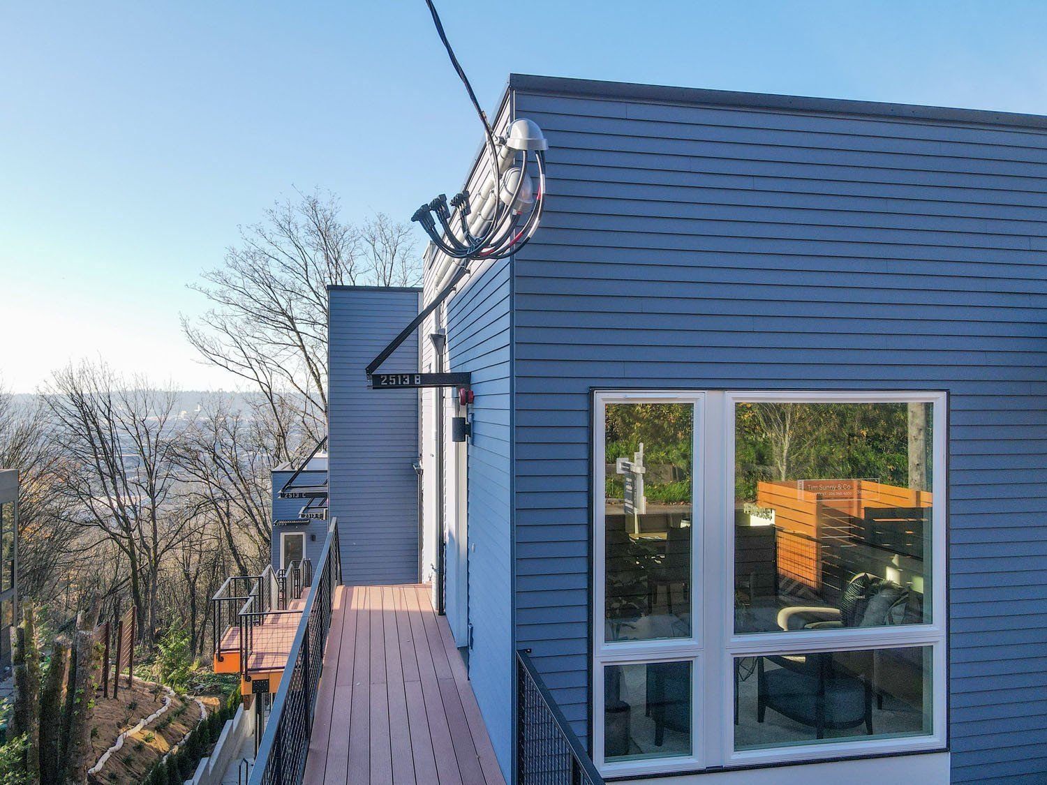 A house with a balcony and a large window