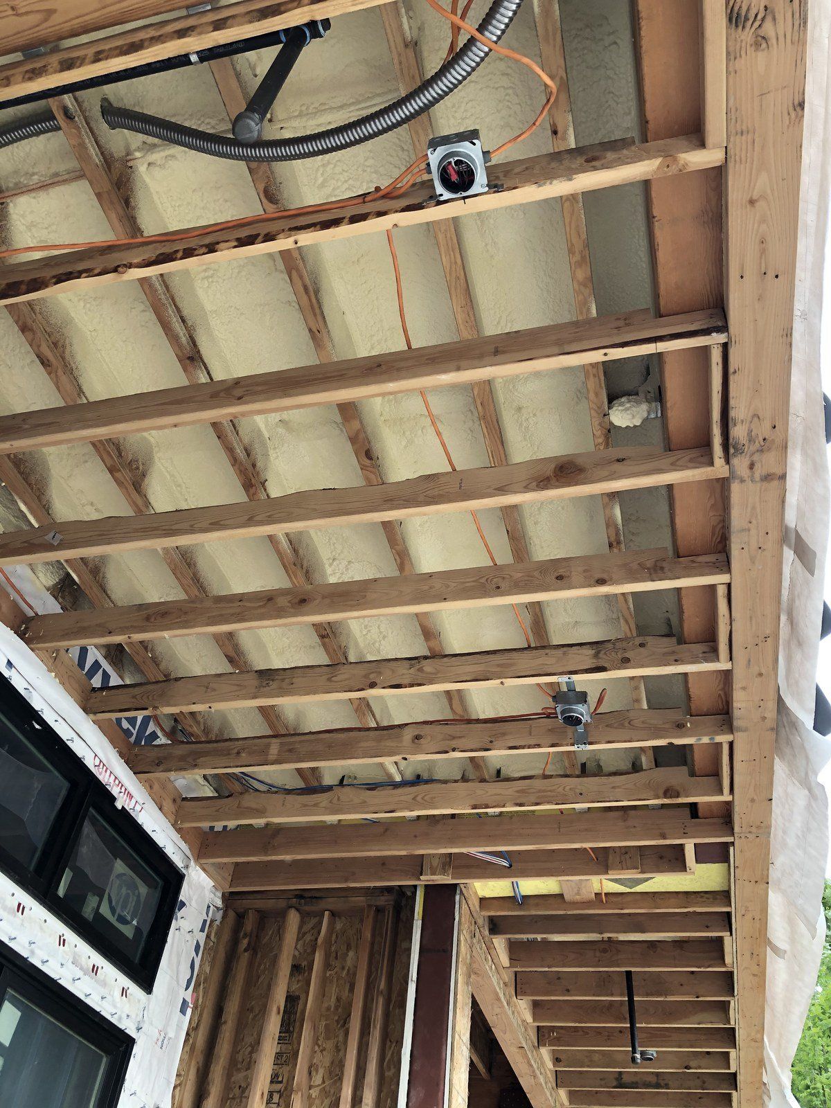 A picture of the ceiling of a house under construction.