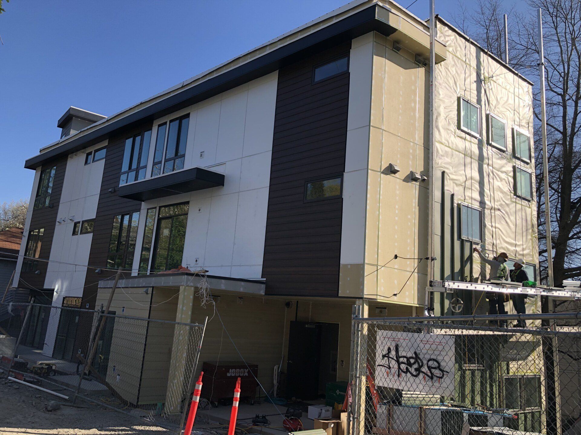 A large building with a lot of windows is being built.
