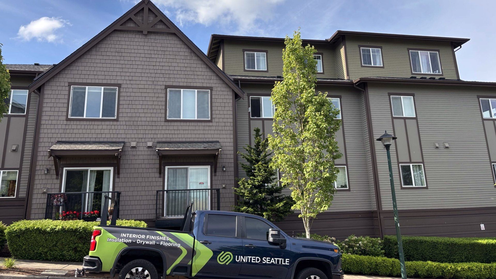 Ashford at Vista Park condominiums in Issaquah, WA with a United Seattle truck during the HOA roofing and siding program