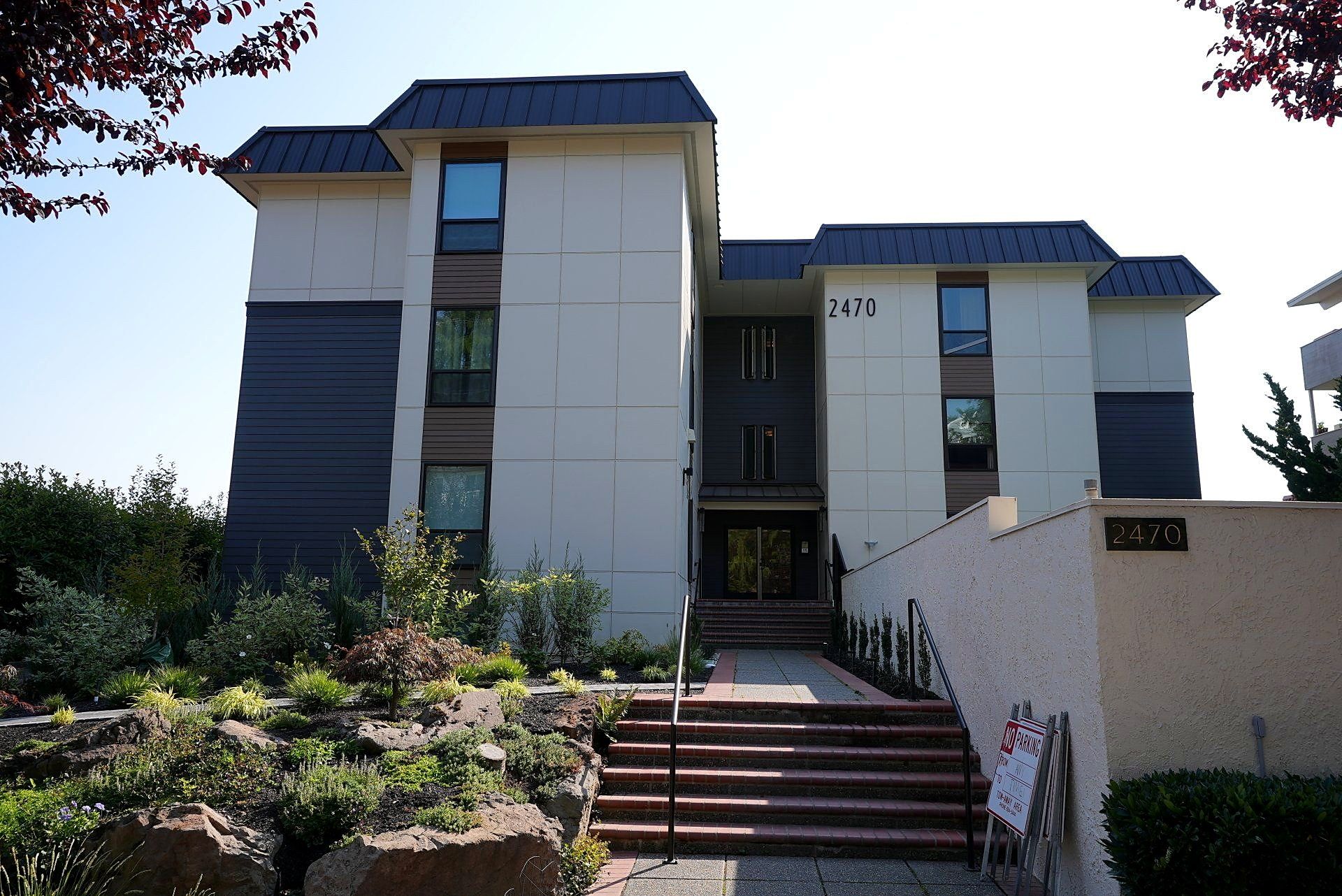 A large white building with stairs leading up to it