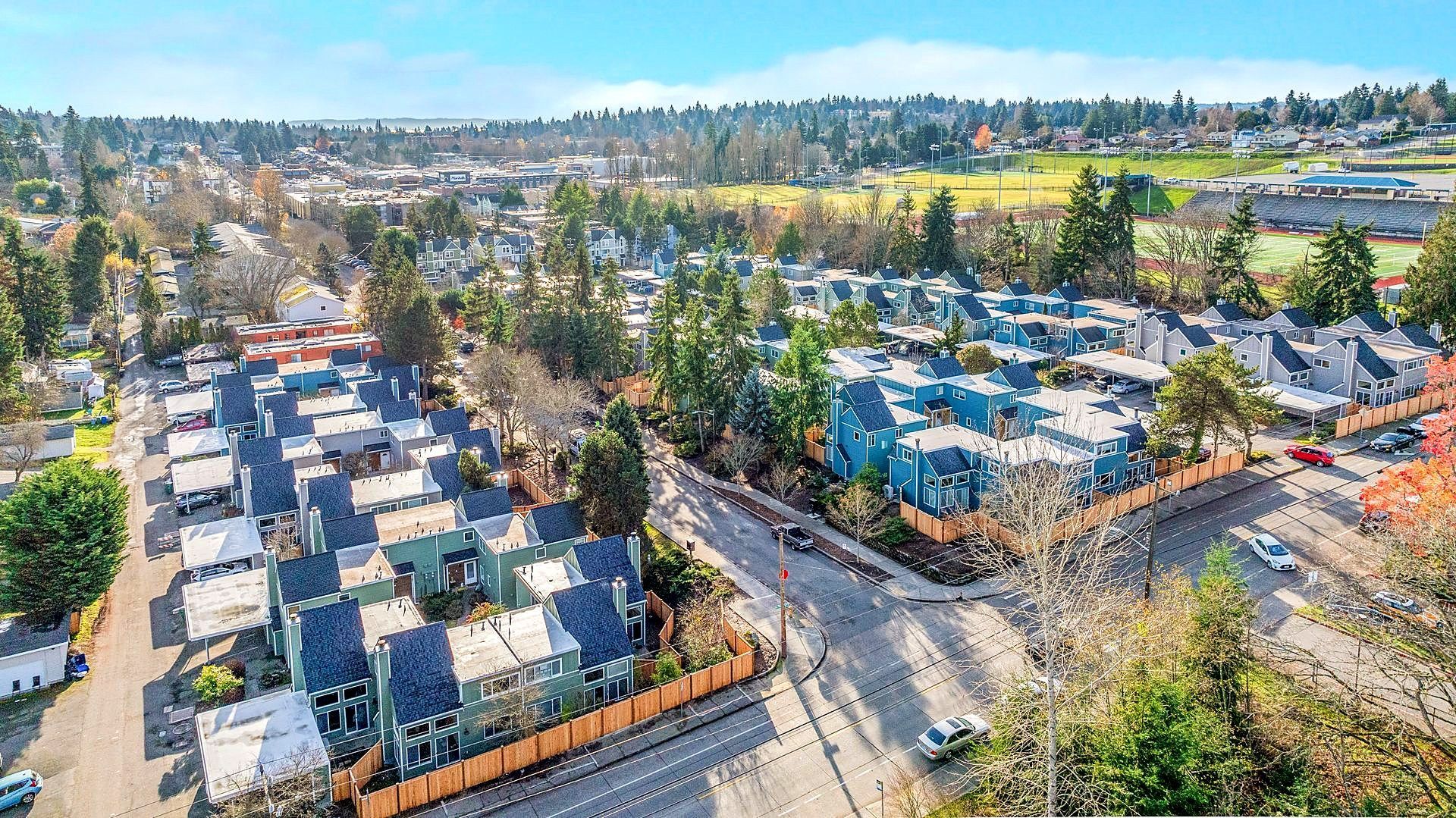 An aerial view of a residential area with lots of houses and trees.