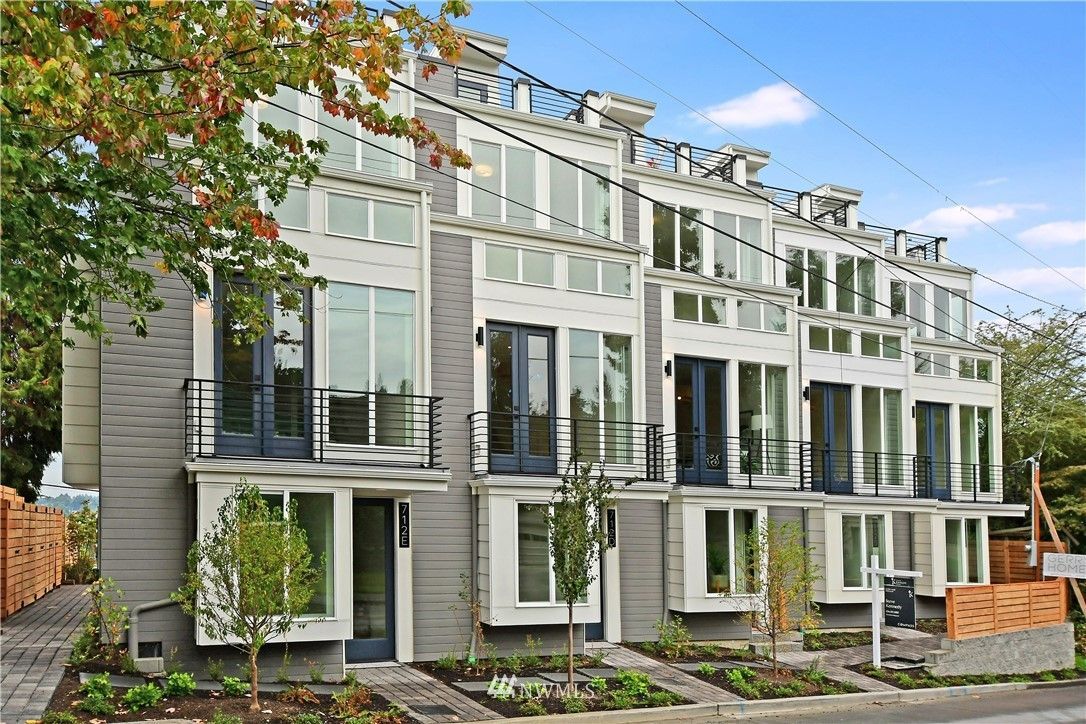 A row of apartment buildings with lots of windows and balconies.