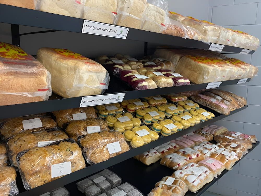 A Bakery Filled With Lots Of Different Types Of Bread And Pastries — Cedar Park Bakehouse in Taranganba, QLD