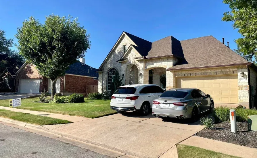 modified bitumen, bitumen roofing services, modified bitumen roofing austin, Modified Bitumen roofing - HD Roofing And Repairs Suburban house with two cars parked in driveway on a sunny day.
