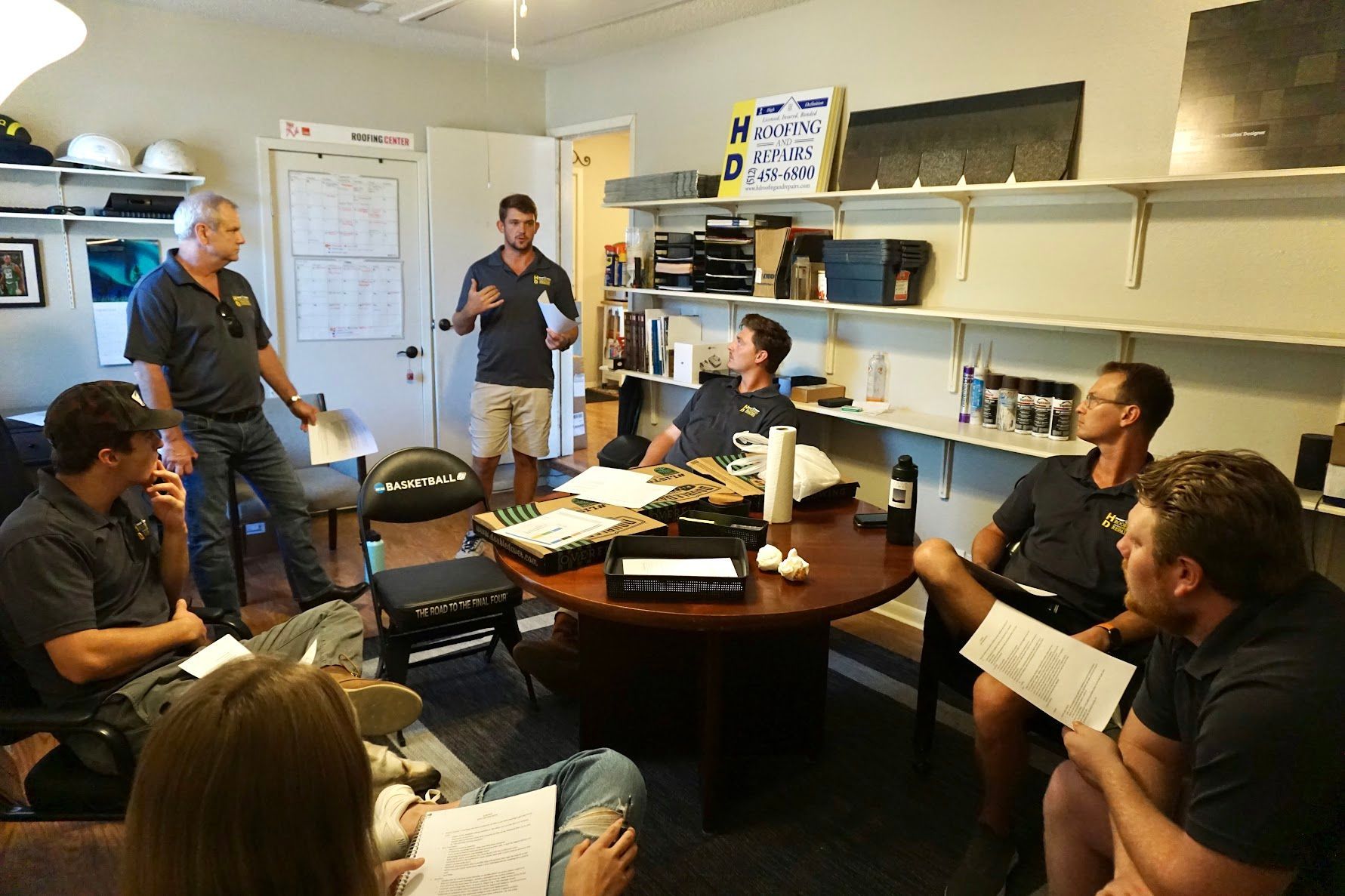 HD Roofing and Repairs team meeting in the office