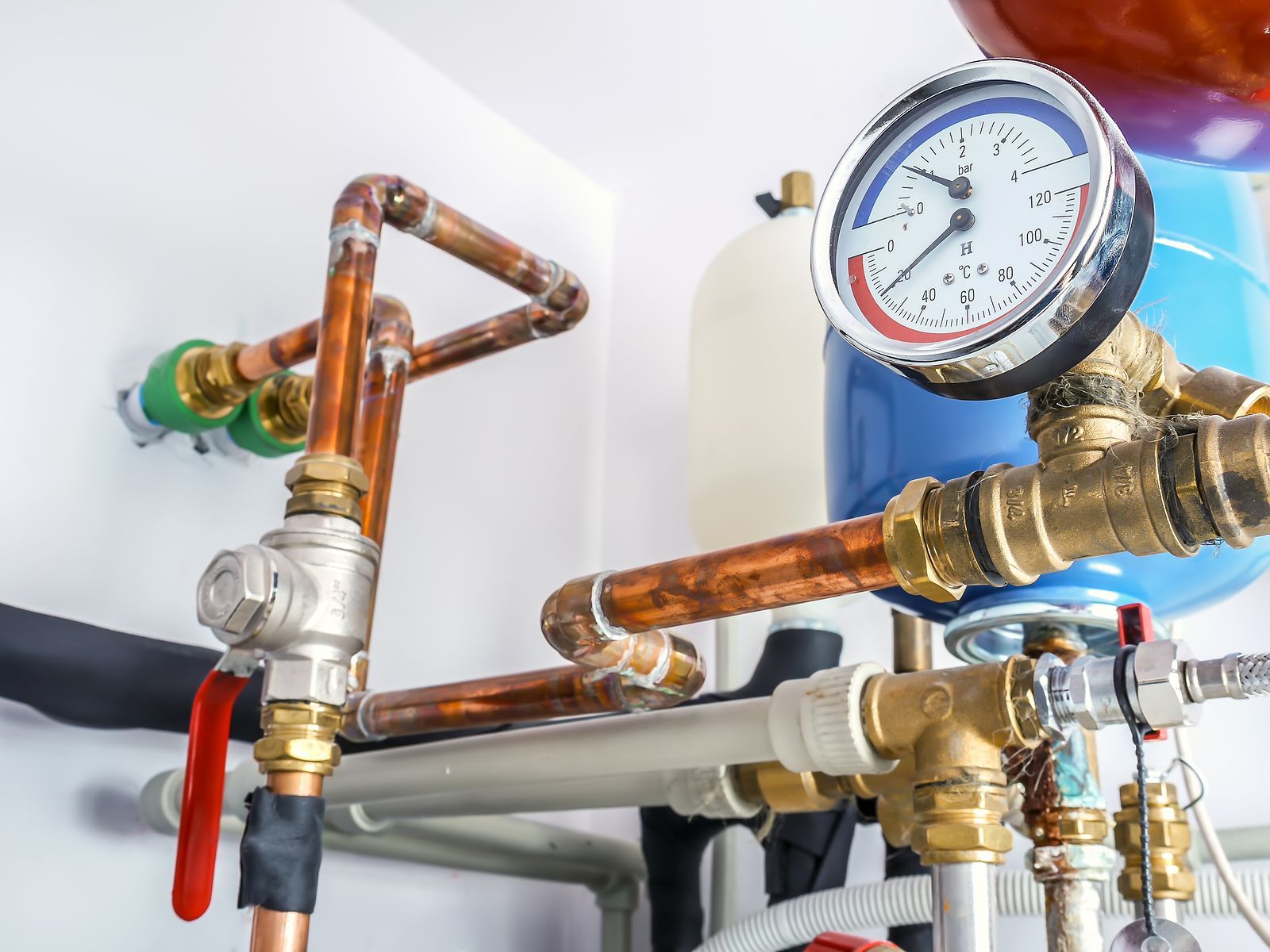 Copper pipes and gauges on a heating system.