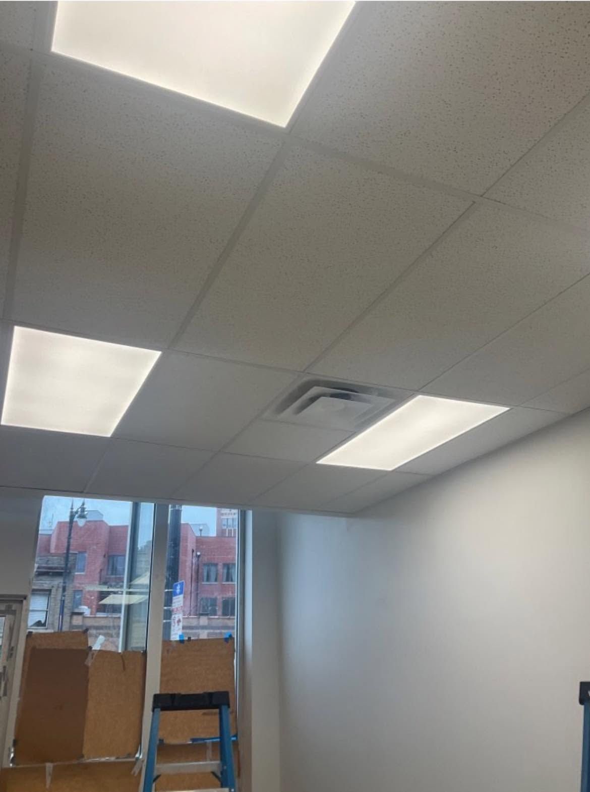 Facility manager using a digital tablet to monitor commercial building climate systems.