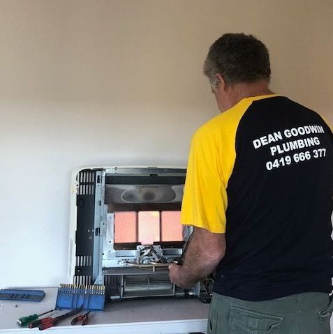 Dean fixing heater— Dean Goodwin Plumbing Pty Ltd in Shellharbour, NSW