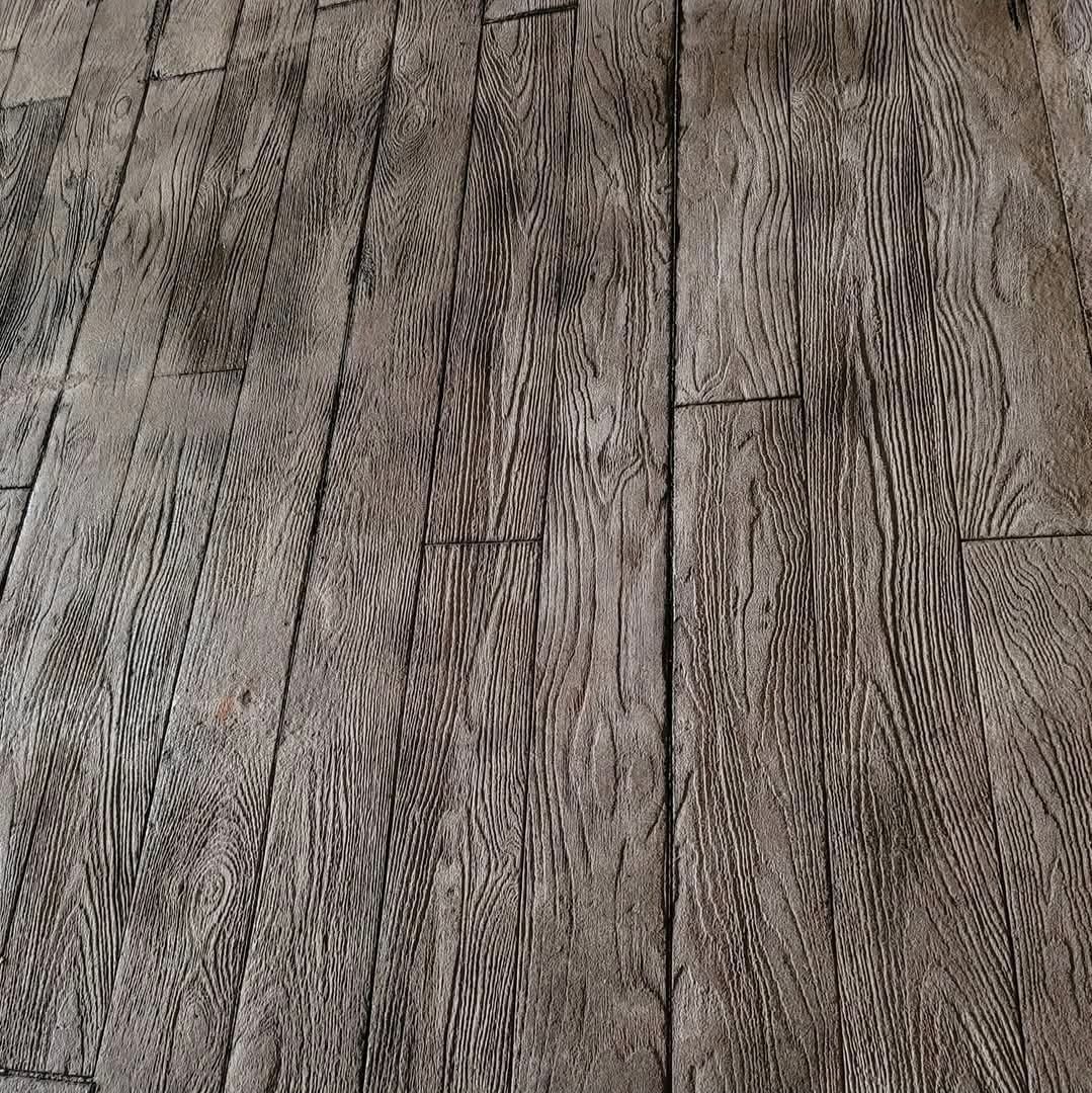 Gray weathered wooden floorboards with visible grain and knots
