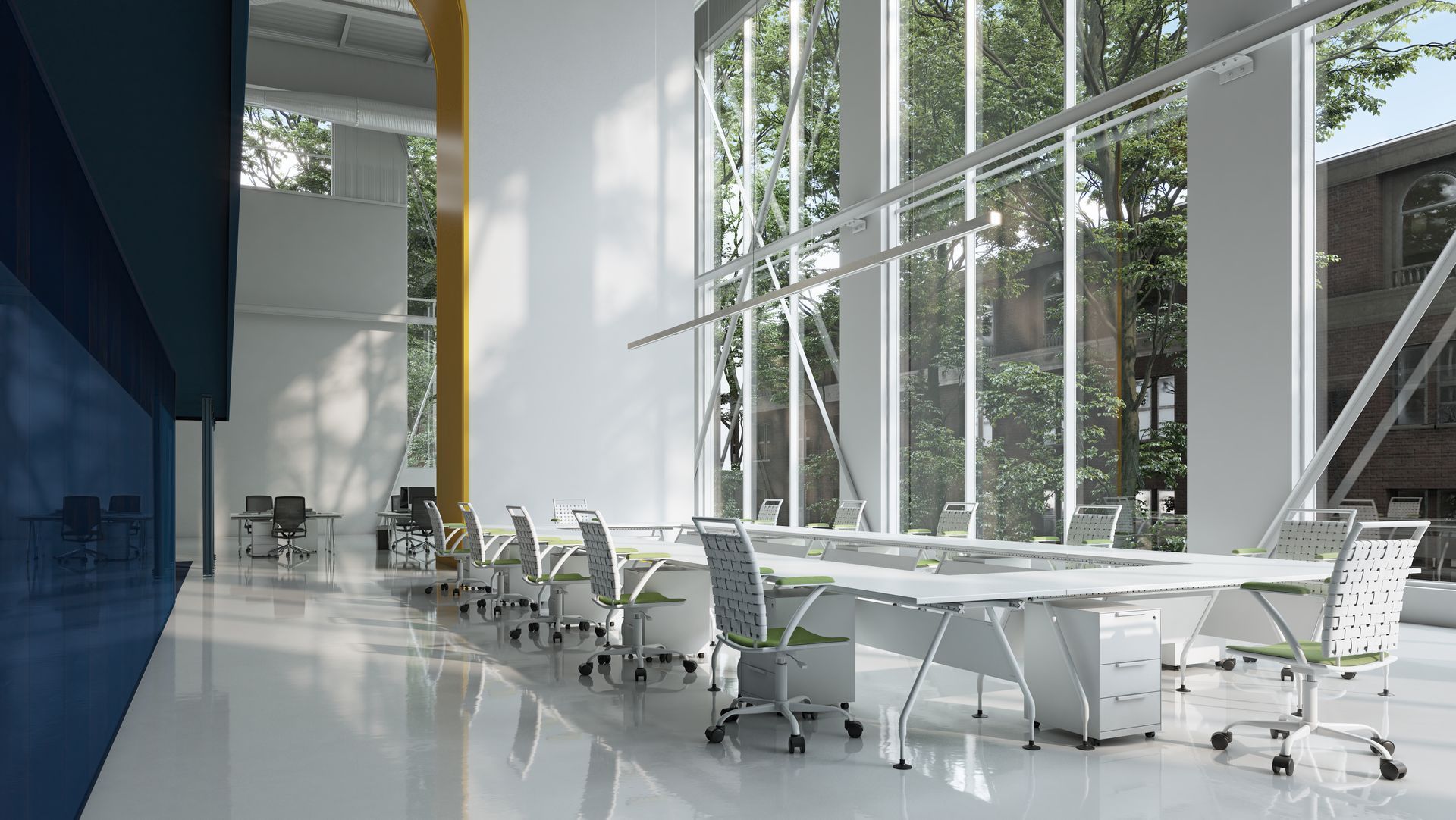 Modern glass conference room with white tables, rolling chairs, and large windows overlooking greenery