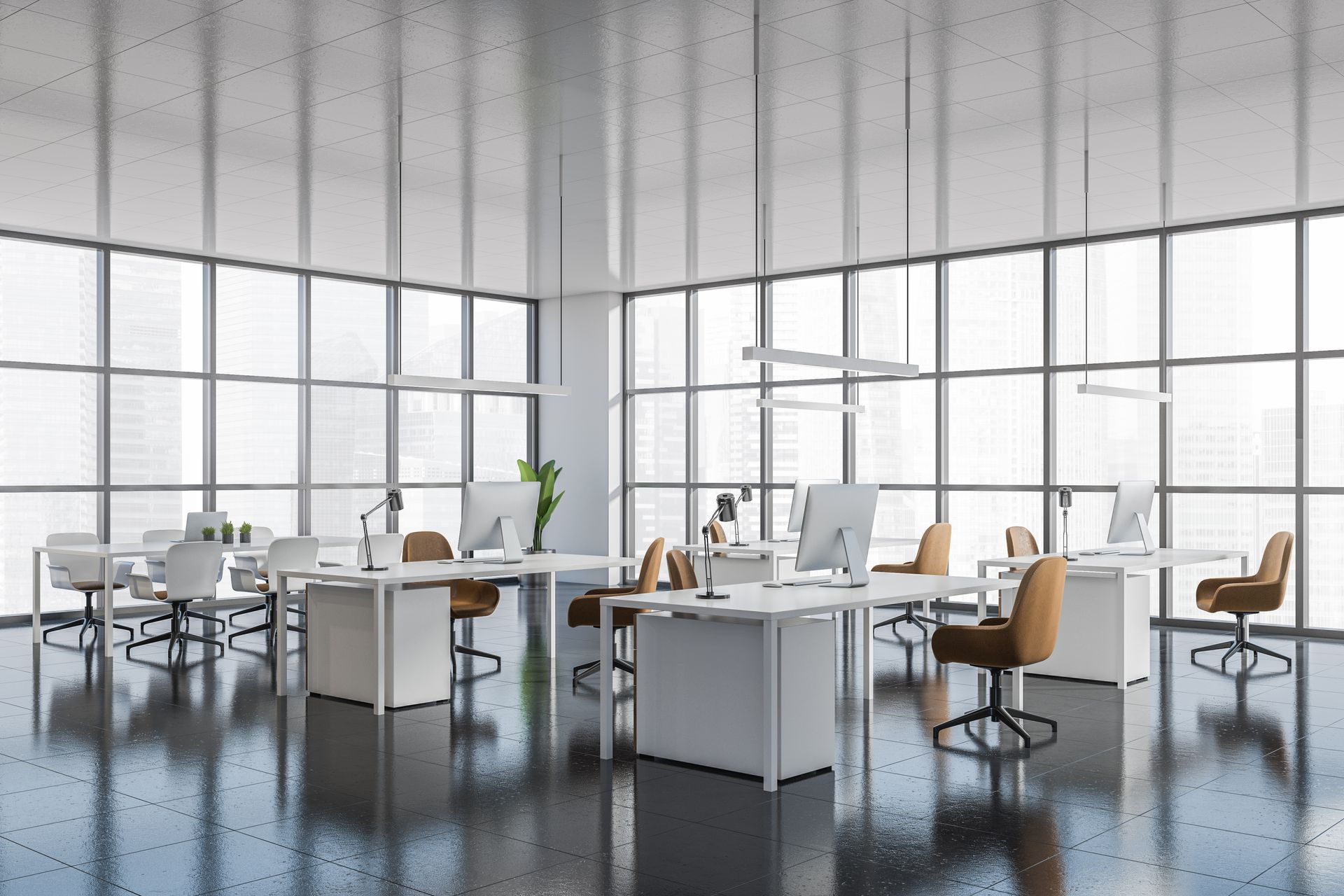 Modern open-plan office with white desks, chairs, and large floor-to-ceiling windows