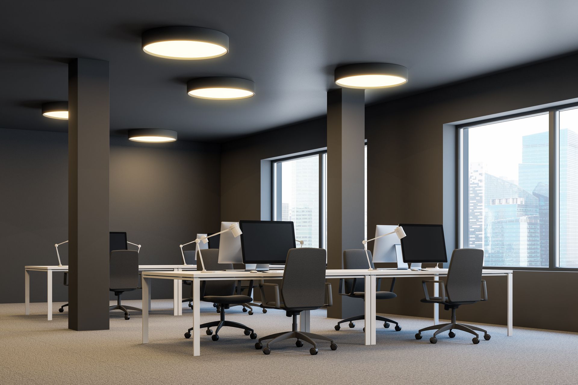 Modern conference room with a long table, white chairs, large windows, and a wall-mounted screen