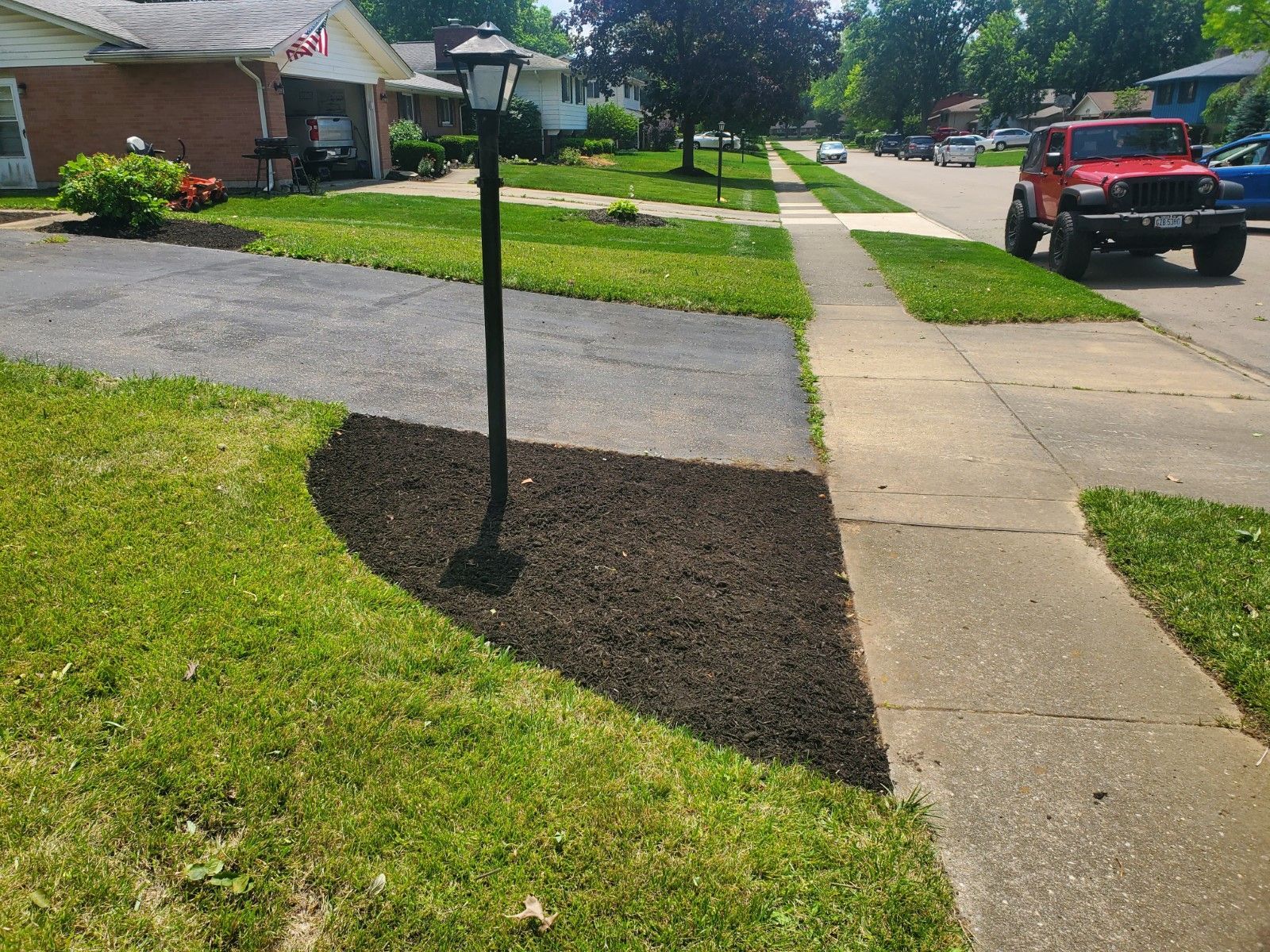 Well kept lawn and driveway area.