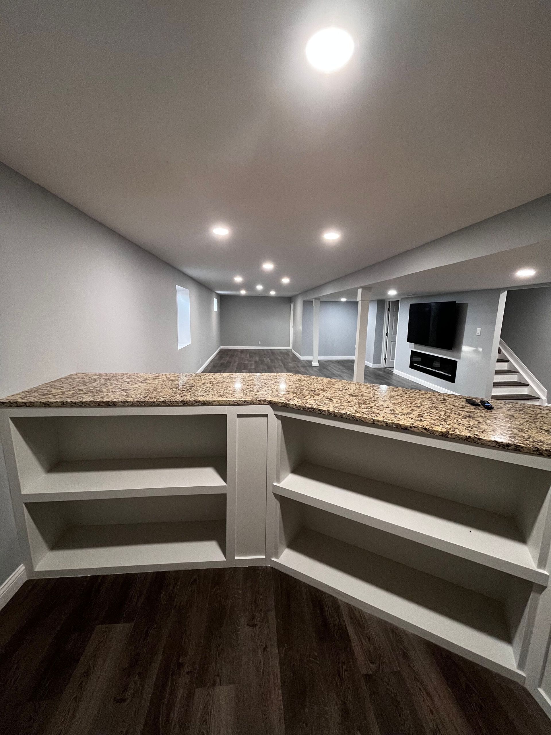 basement with sofa and television