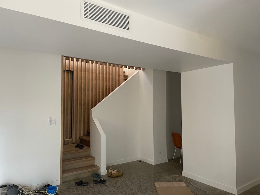 Interior With Stairs, White Walls, Wood Slat Feature, Carpet — On The Rise Builders in Maroochydore, QLD