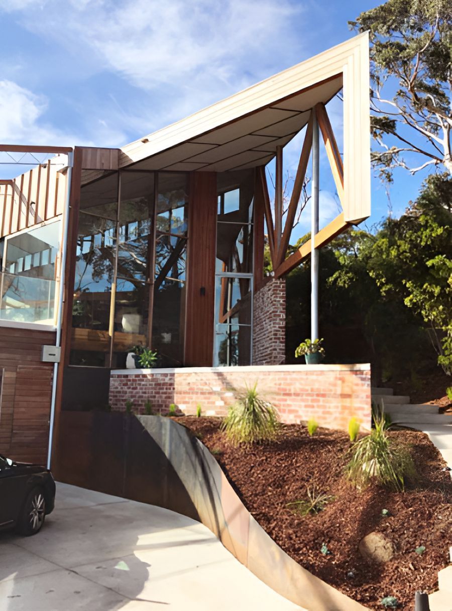 Modern House Exterior with Glass Walls, Brick Accents — On The Rise Builders in North Arm, QLD