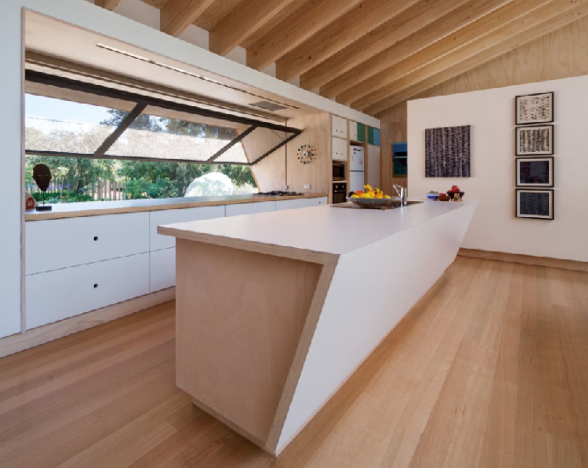 Modern Kitchen with White Island, Cabinets, Large Window — On The Rise Builders in North Arm, QLD