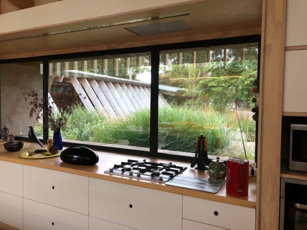 Kitchen with Large Window Overlooking Greenery — On The Rise Builders in North Arm, QLD