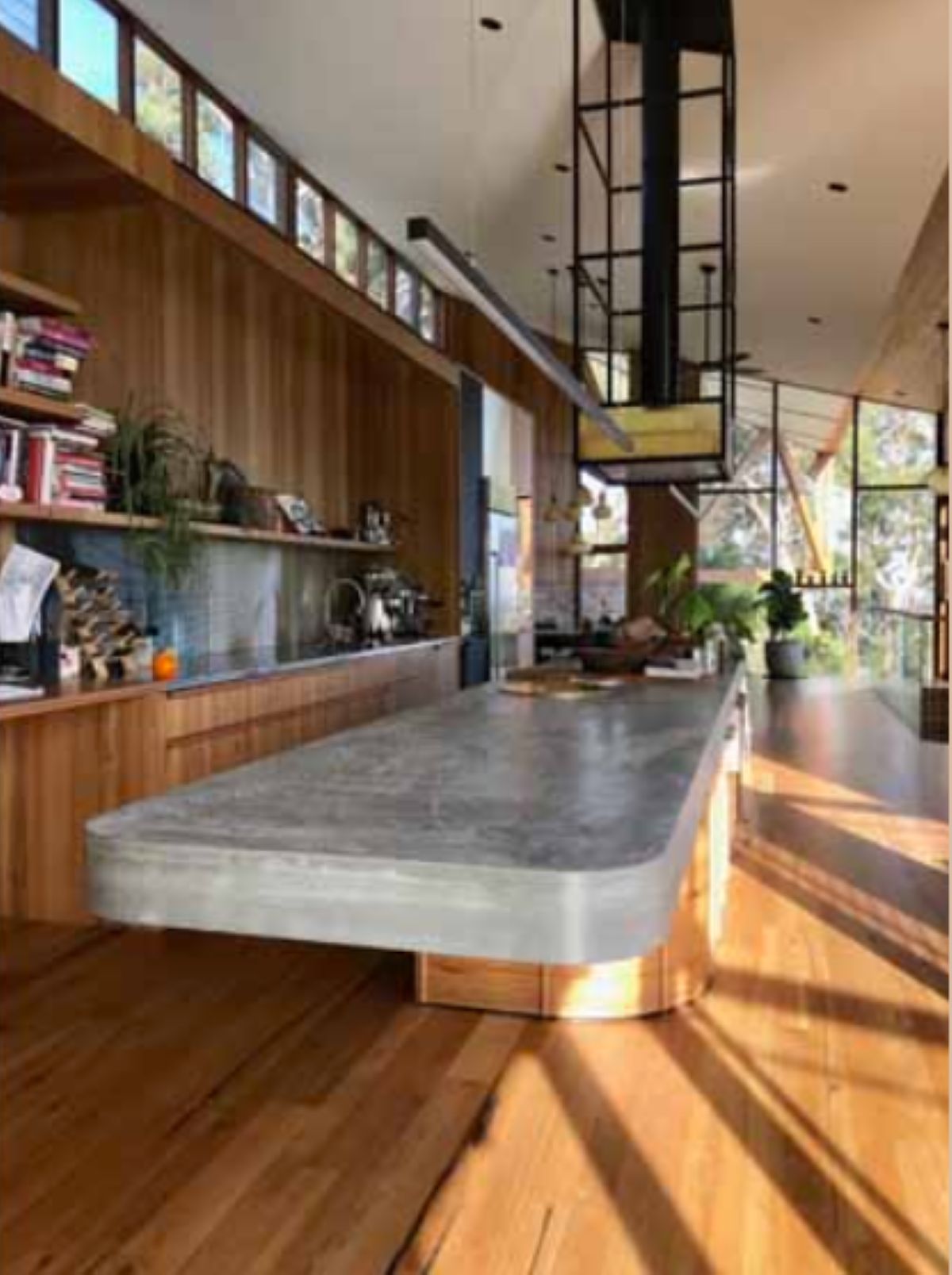 Modern Kitchen with A Concrete Island, Wood Cabinetry — On The Rise Builders in Nambour, QLD