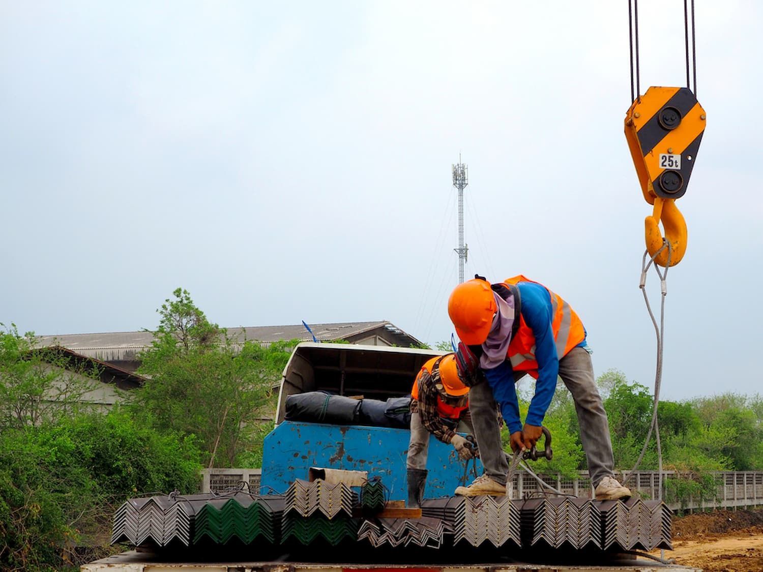 Two Construction Workers Are Working on A Truck Being Lifted by A Crane —  D & S Crane Hire & Rigging In Gympie, QLD