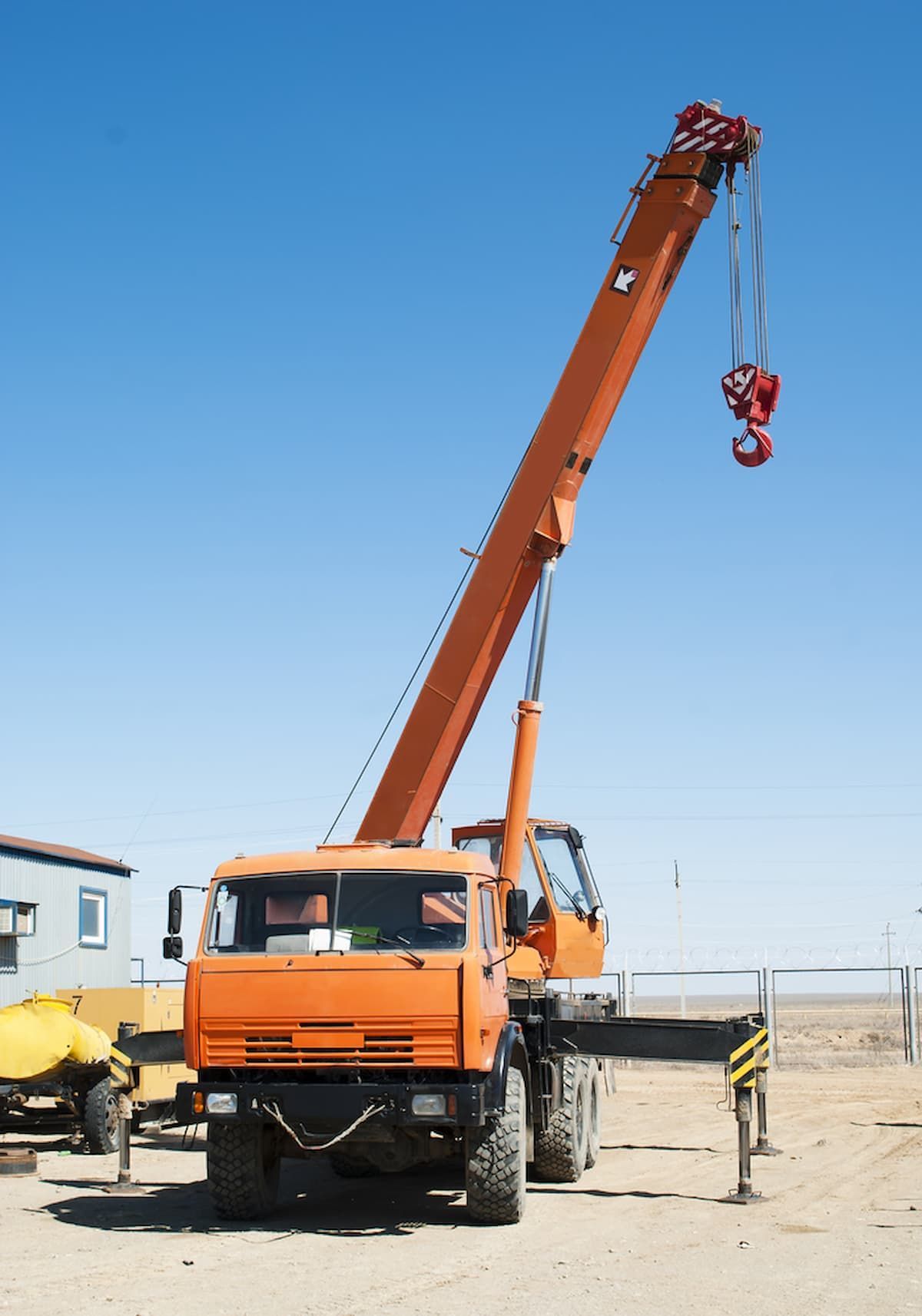 An Orange Truck with A Crane Attached to It — D & S Crane Hire & Rigging In Kunda Park, QLD