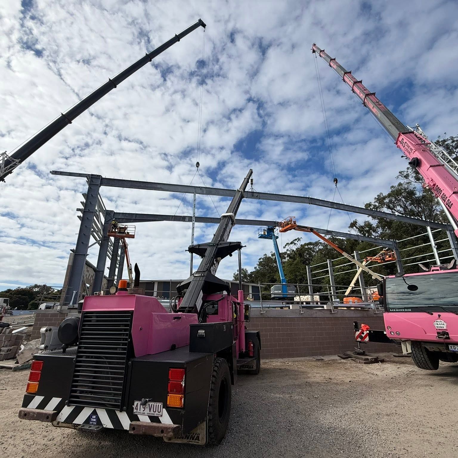 A Pink Crane On A Site Building