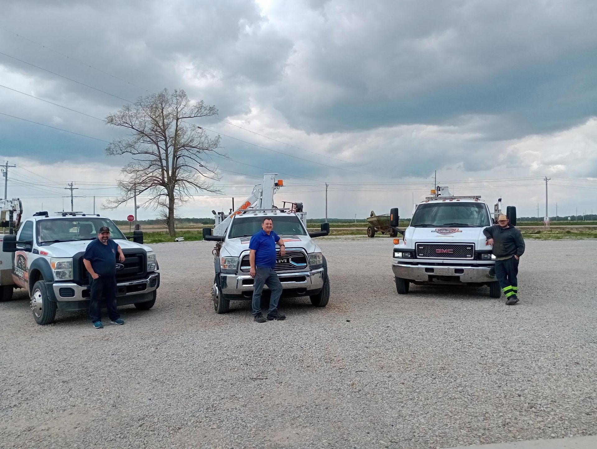 Forbs Tire employees in front of trucks