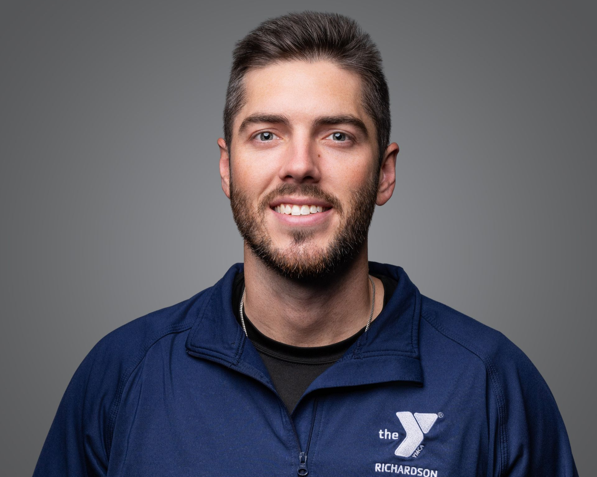 The Y YMCA logo in blue and purple