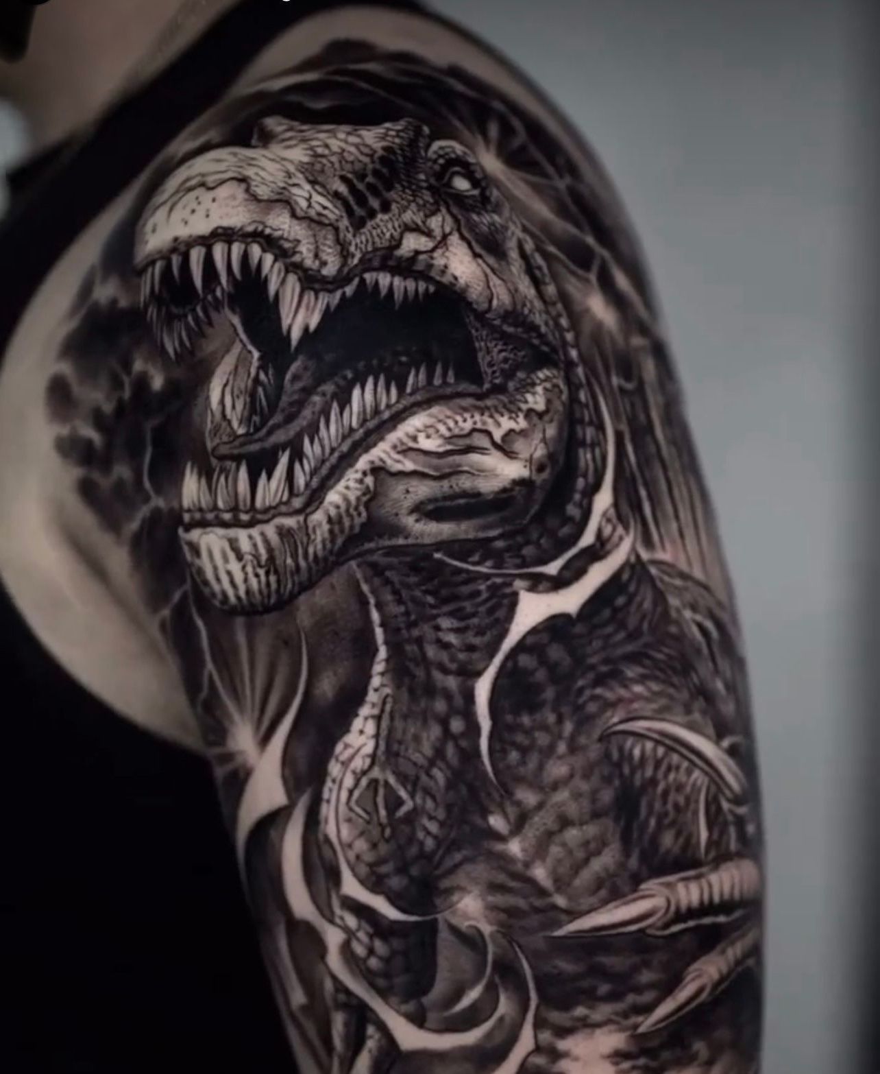 Black And Grey Realism T-Rex Upper Sleeve by @Ink.Artisan | Balck Craft Tattoo Collective Miami