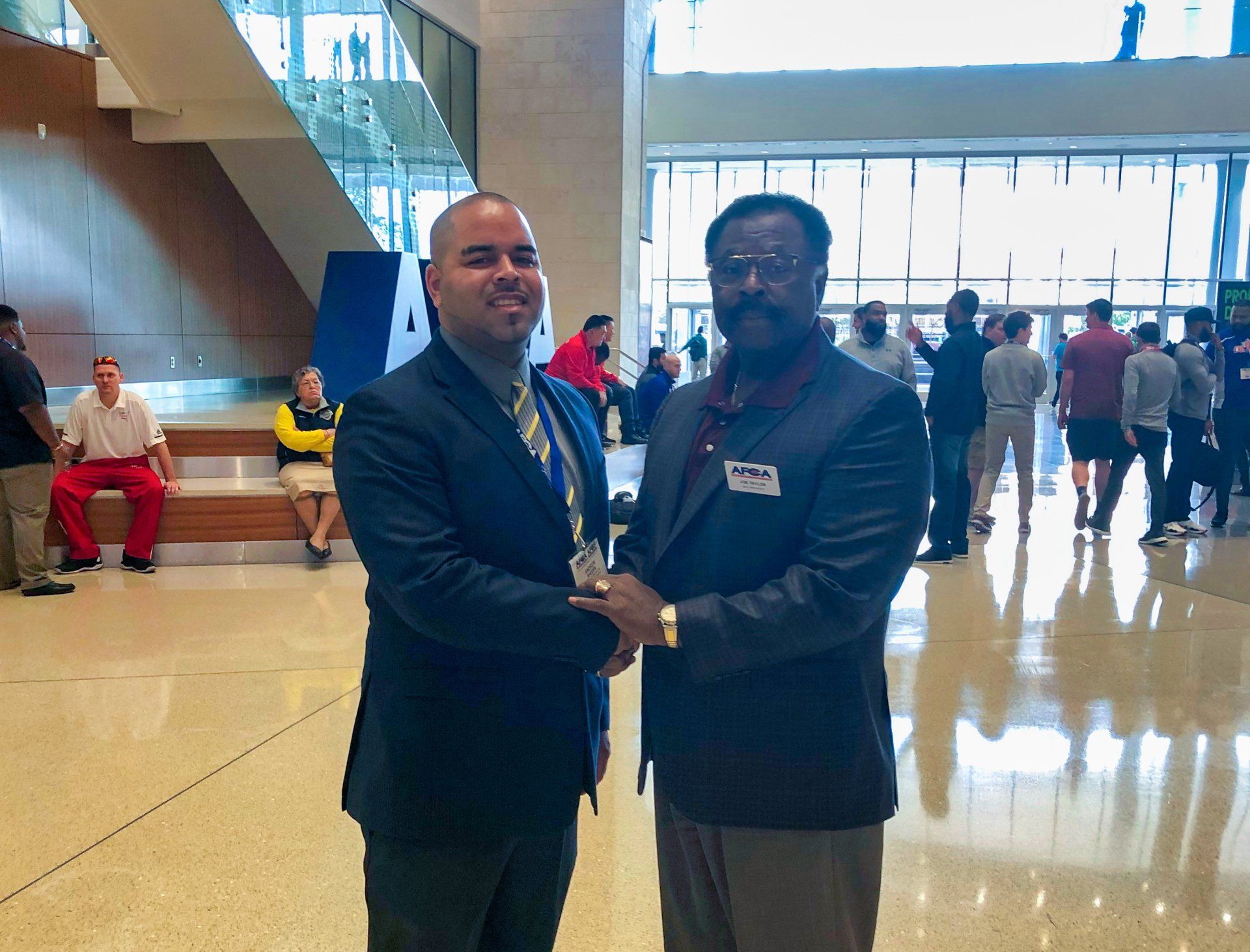 Two men shaking hand. with a better services. 