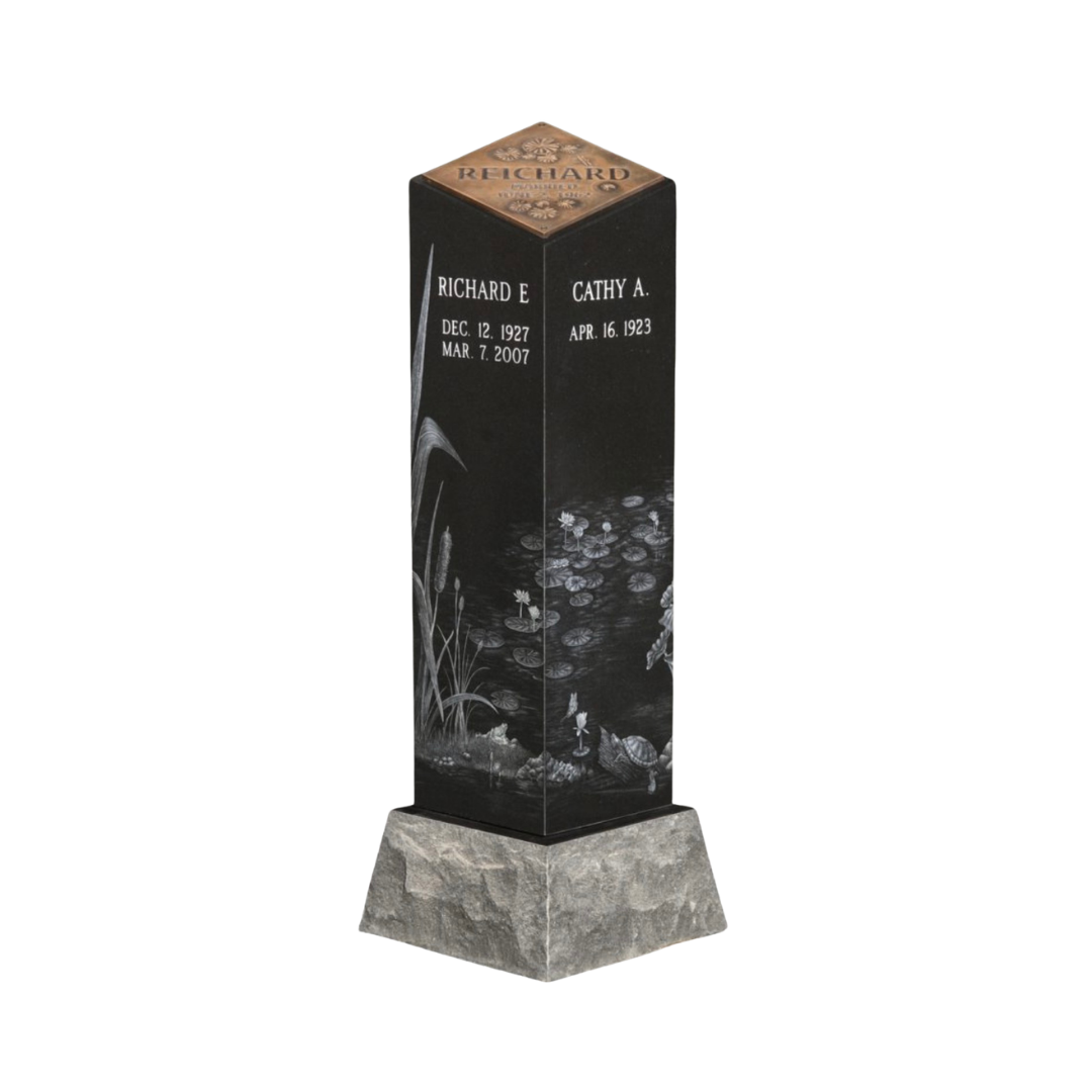 Four-sided upright monument laser engraved on all sides with a flat, engraved bronze plate on top.
