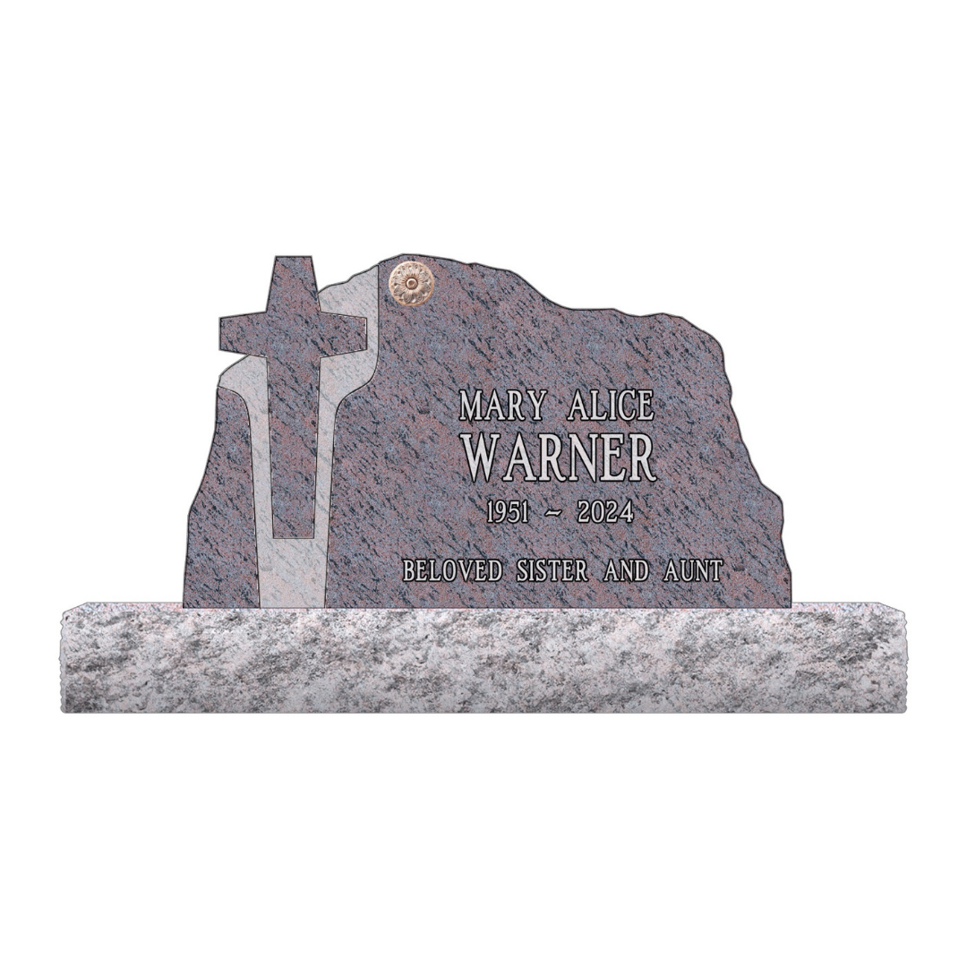 Upright monument with a cross cutout and a brass circle on the face.